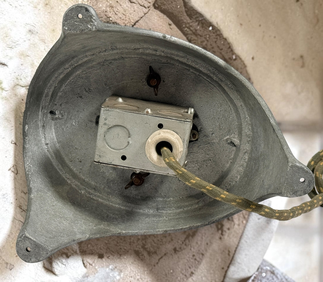 Working antique electric millinery hat block heater with cast aluminum housing and original ceramic heating element. Rare professional hat making equipment from the mid-20th century.