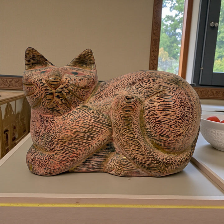 Hand-carved wooden cat sculpture in folk art style. Solid wood, decorative carved texture, warm natural finish. Unique décor piece for cat lovers.