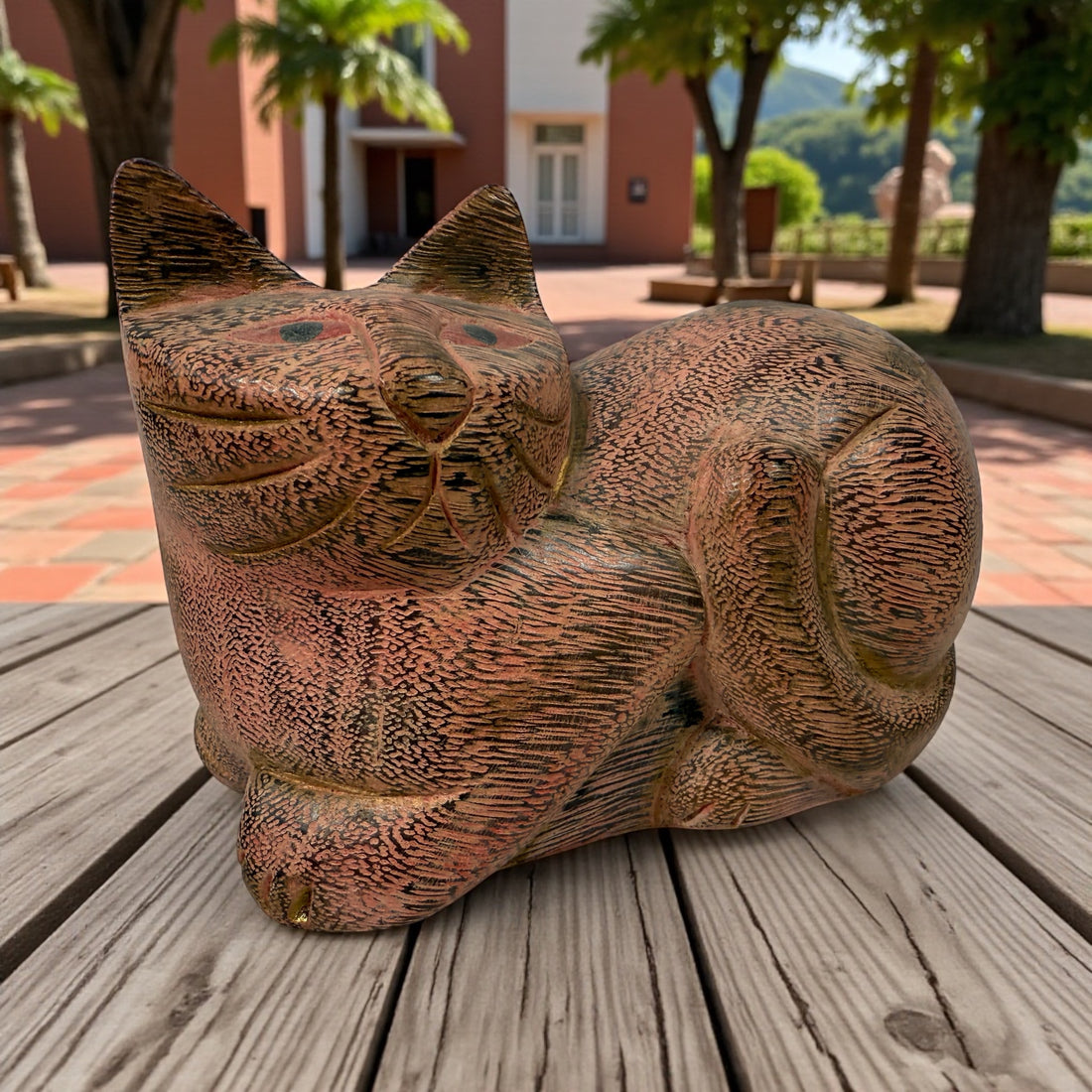 Hand-carved wooden cat sculpture in folk art style. Solid wood, decorative carved texture, warm natural finish. Unique décor piece for cat lovers.