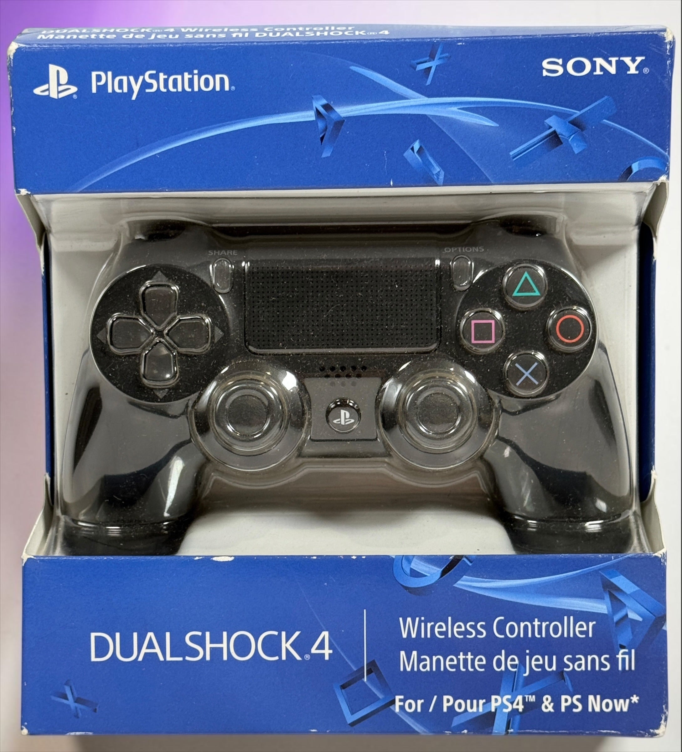 Genuine Sony DualShock 4 V2 wireless PS4 controller complete with original box and inner tray. Tested, fully functional, and ready to play.