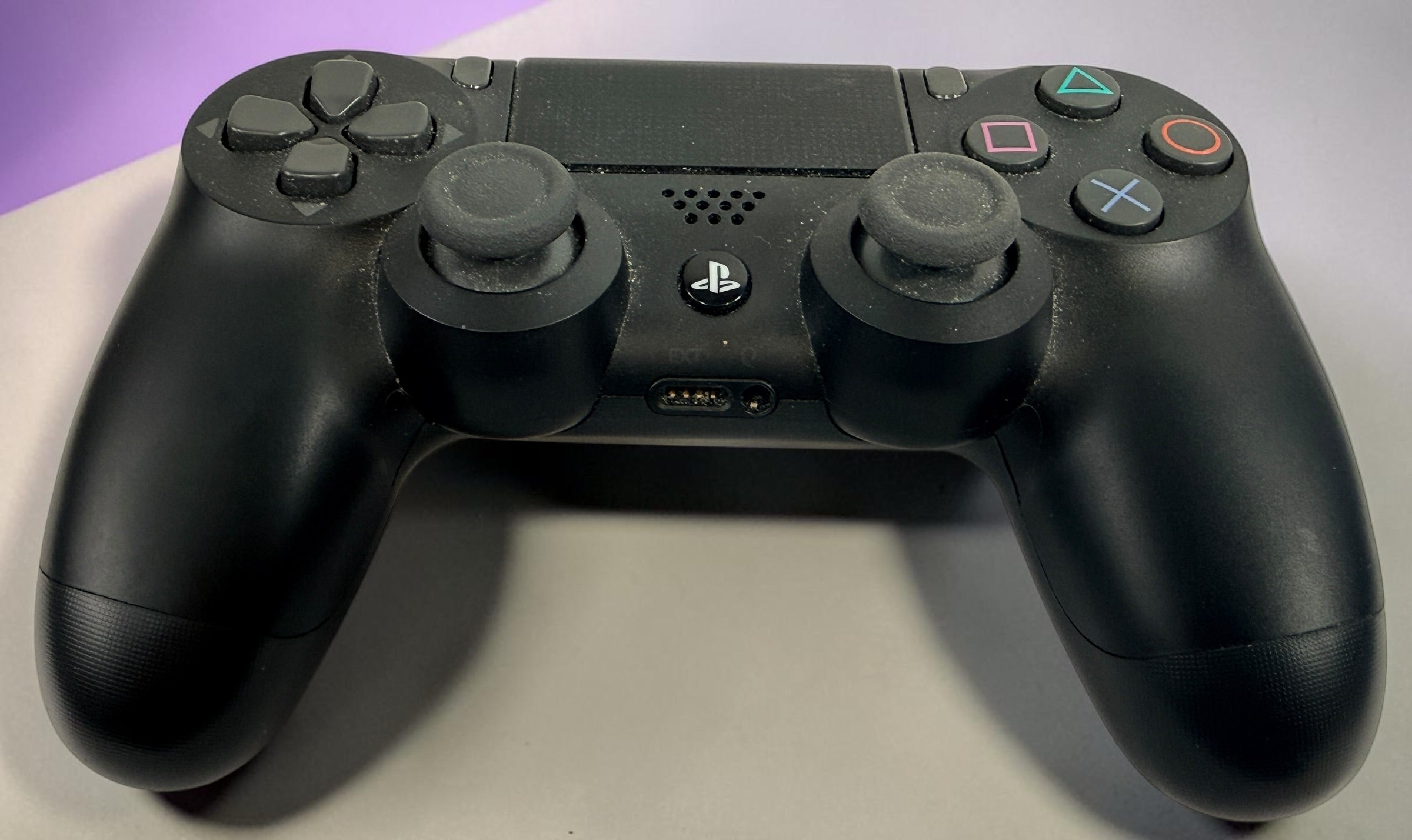 Genuine Sony DualShock 4 V2 wireless PS4 controller complete with original box and inner tray. Tested, fully functional, and ready to play.