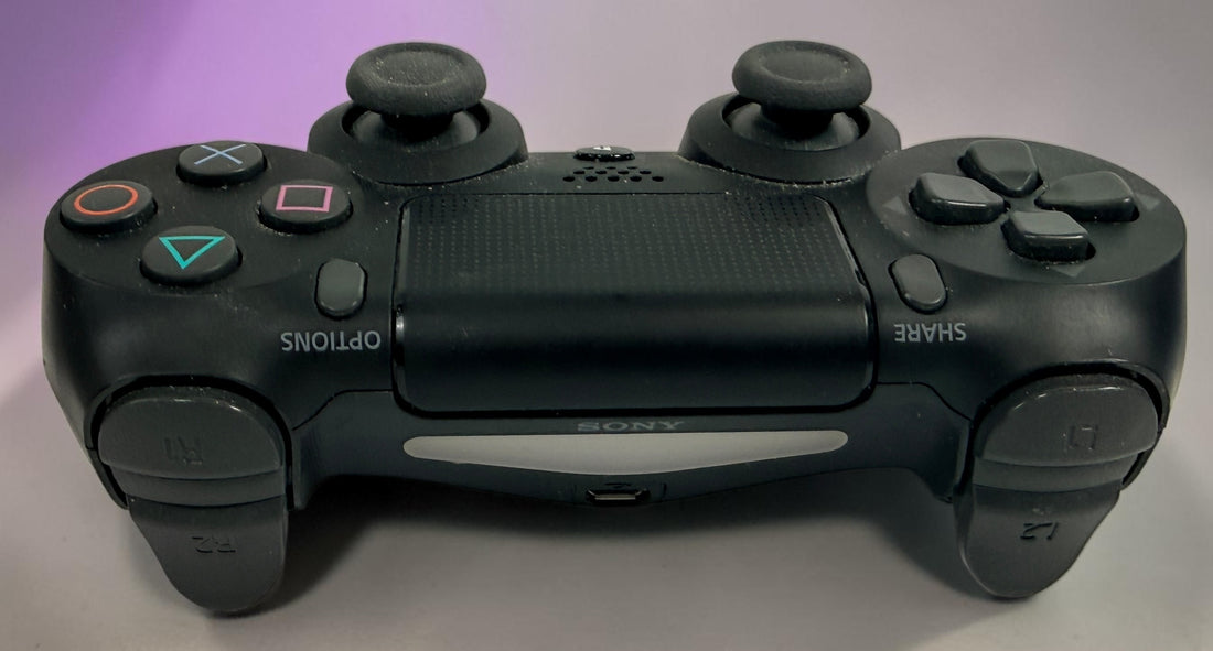 Genuine Sony DualShock 4 V2 wireless PS4 controller complete with original box and inner tray. Tested, fully functional, and ready to play.