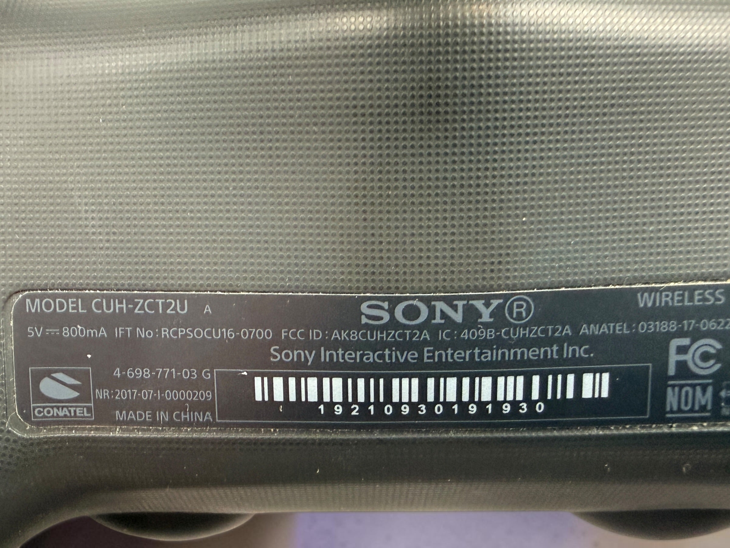 Genuine Sony DualShock 4 V2 wireless PS4 controller complete with original box and inner tray. Tested, fully functional, and ready to play.