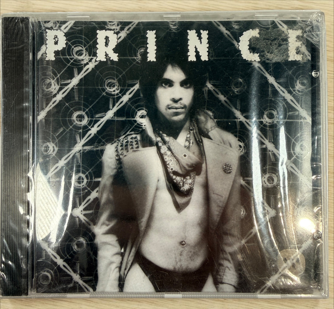 Factory-sealed Canadian pressing of Prince’s Dirty Mind CD on Warner Bros. Features “When You Were Mine,” “Uptown,” and other classic tracks.