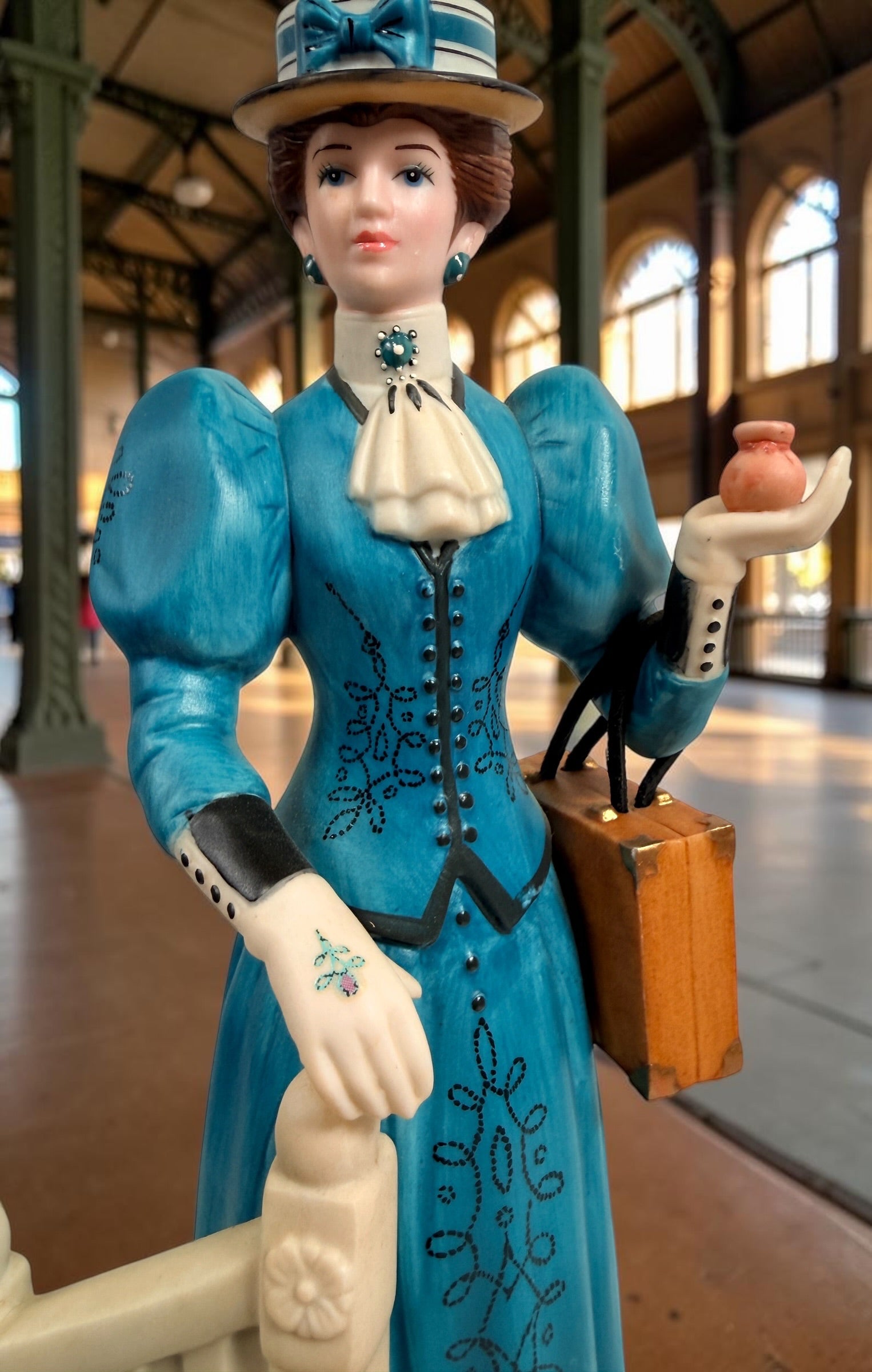 Avon Canada Mrs. Albee President’s Club ceramic figurine from 2009–2010, featuring a Victorian lady in a blue dress with hand-painted details and original inscription.