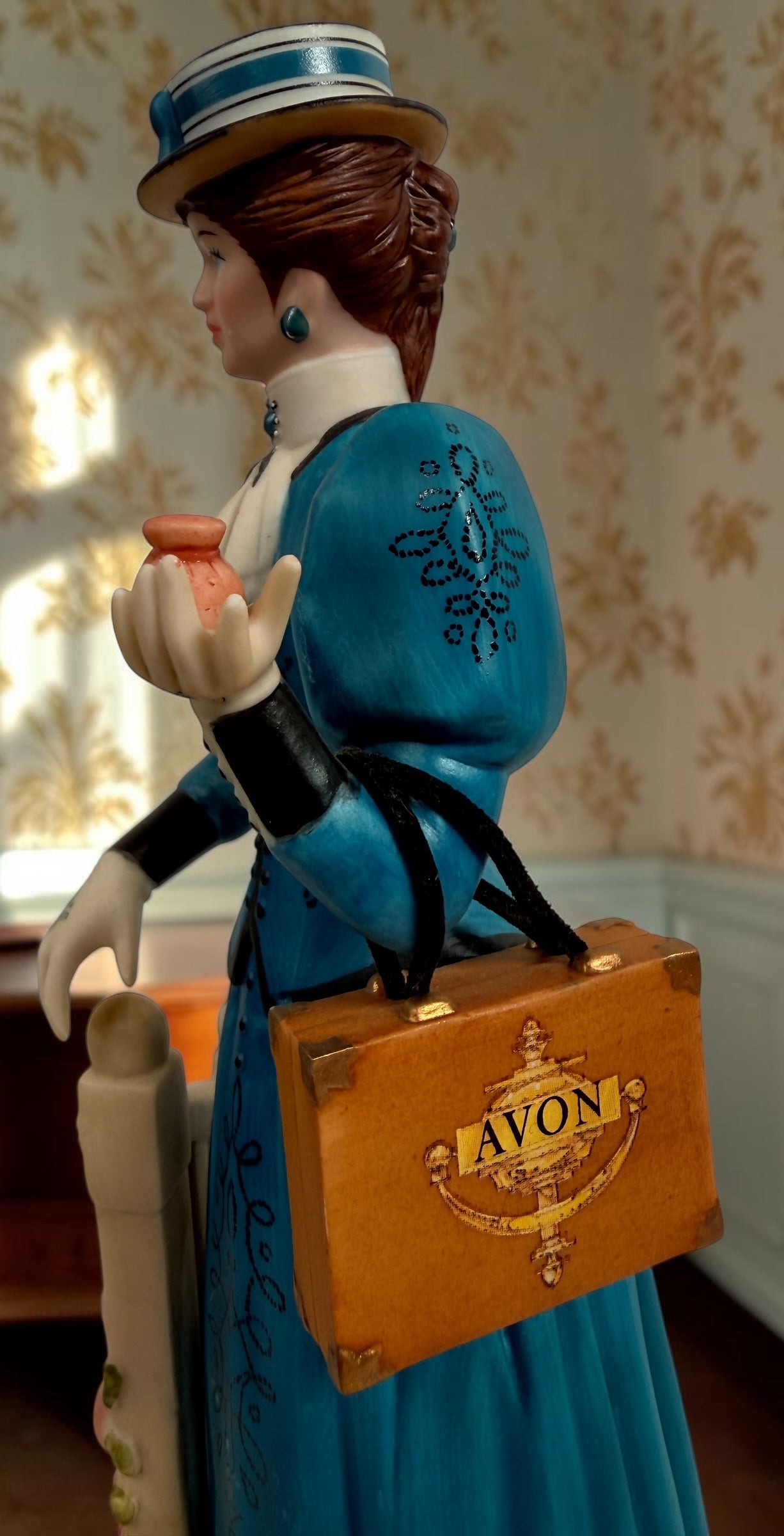 Avon Canada Mrs. Albee President’s Club ceramic figurine from 2009–2010, featuring a Victorian lady in a blue dress with hand-painted details and original inscription.