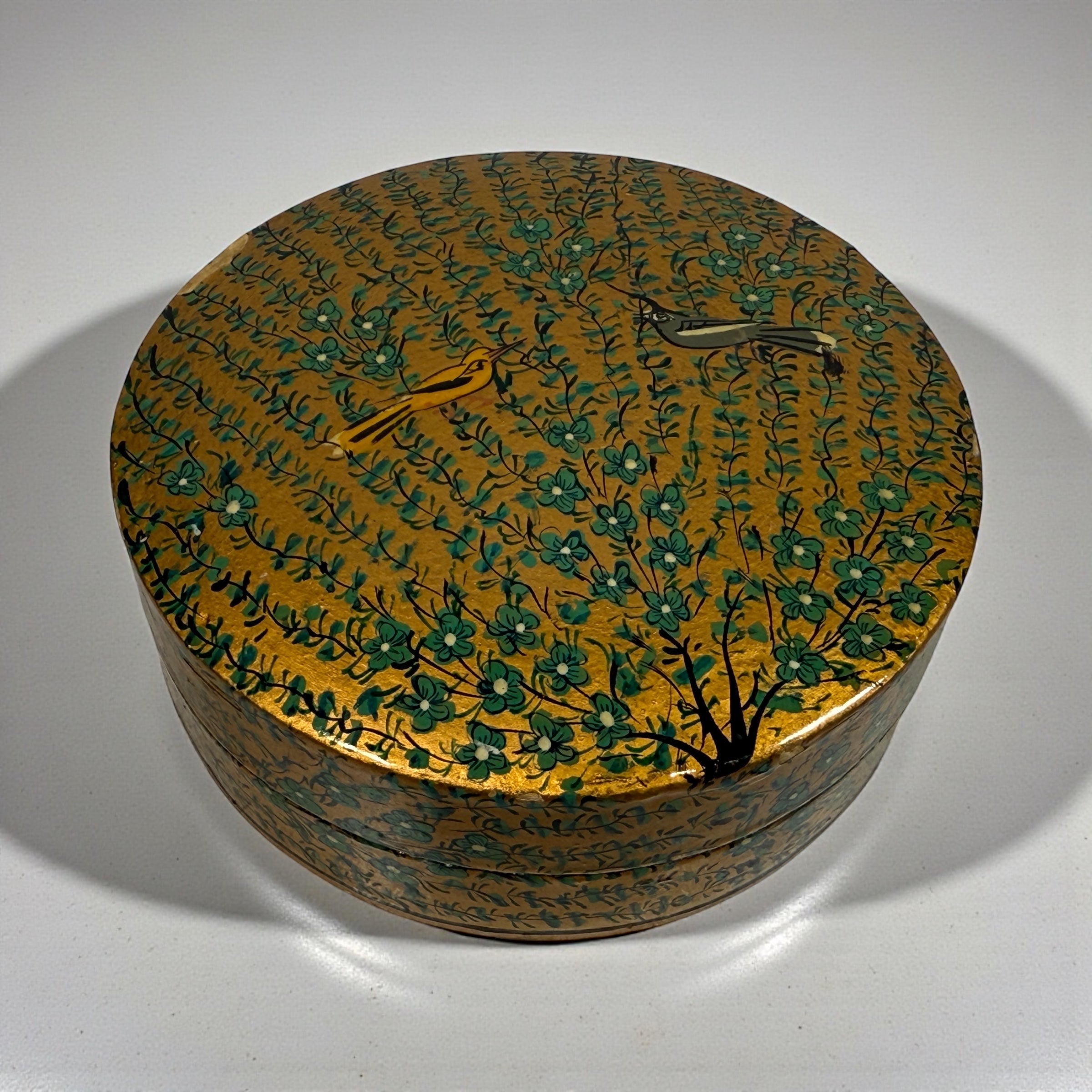 Vintage Kashmiri papier-mâché box with six matching coasters, hand-painted floral and bird design, traditional Indian folk art decor.