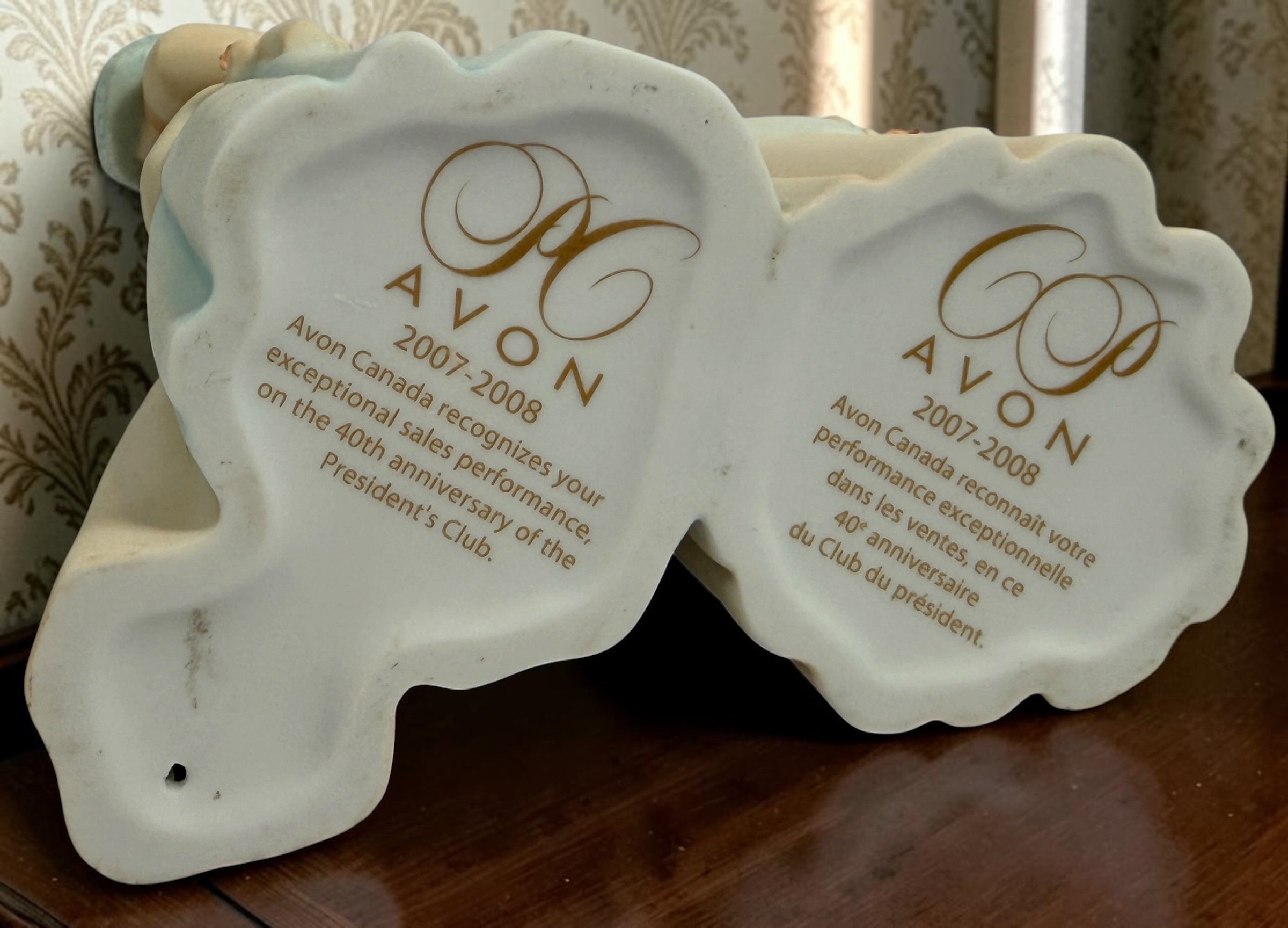 Avon Canada President’s Club 40th Anniversary commemorative figurine from 2007–2008 featuring an elegant lady and floral wedding cake display.