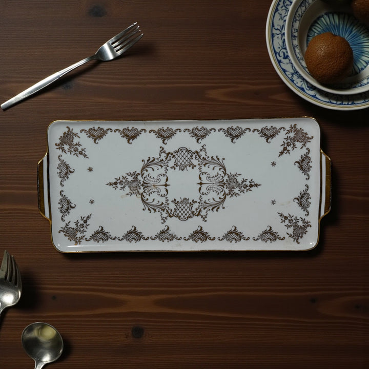 Vintage German porcelain serving tray by R.P.M. with ornate gold gilt and floral décor. Mid-century elegance for tea service or display.
