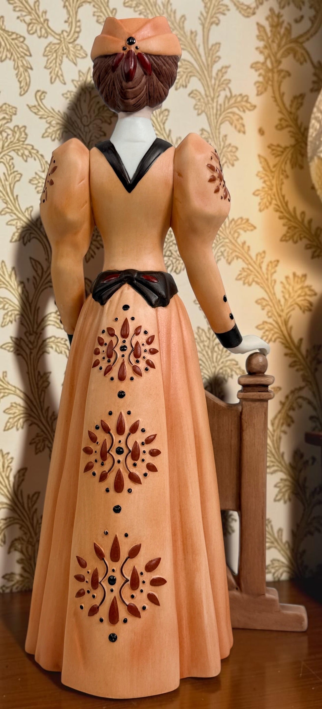 2013–2014 Avon Mrs. P.F.E. Albee award figurine featuring the California Perfume Company sign and Victorian dress. Ceramic collectible in good condition.