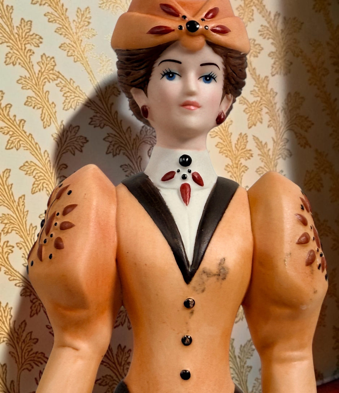 2013–2014 Avon Mrs. P.F.E. Albee award figurine featuring the California Perfume Company sign and Victorian dress. Ceramic collectible in good condition.