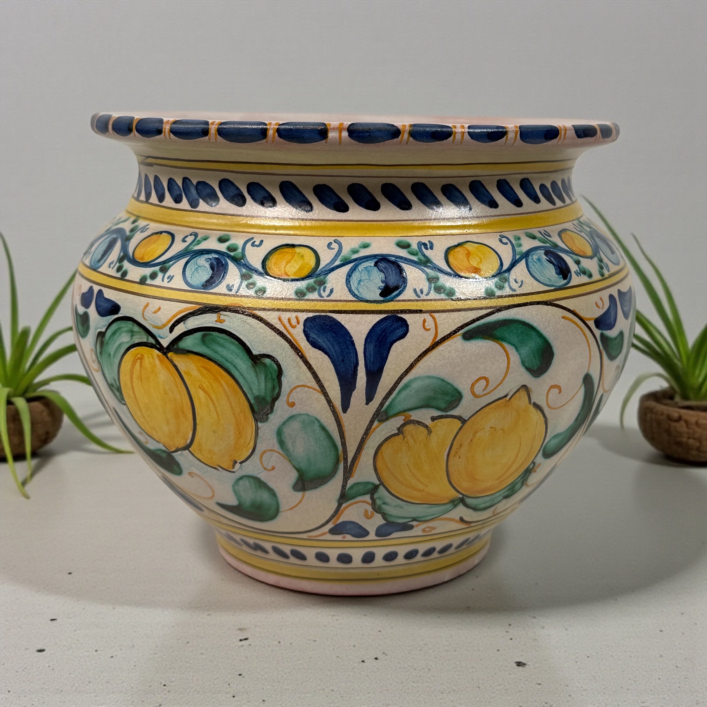 Hand-painted Spanish ceramic planter in blue and yellow majolica style. Vintage decorative cachepot with folk-art charm, ideal for plants or display.