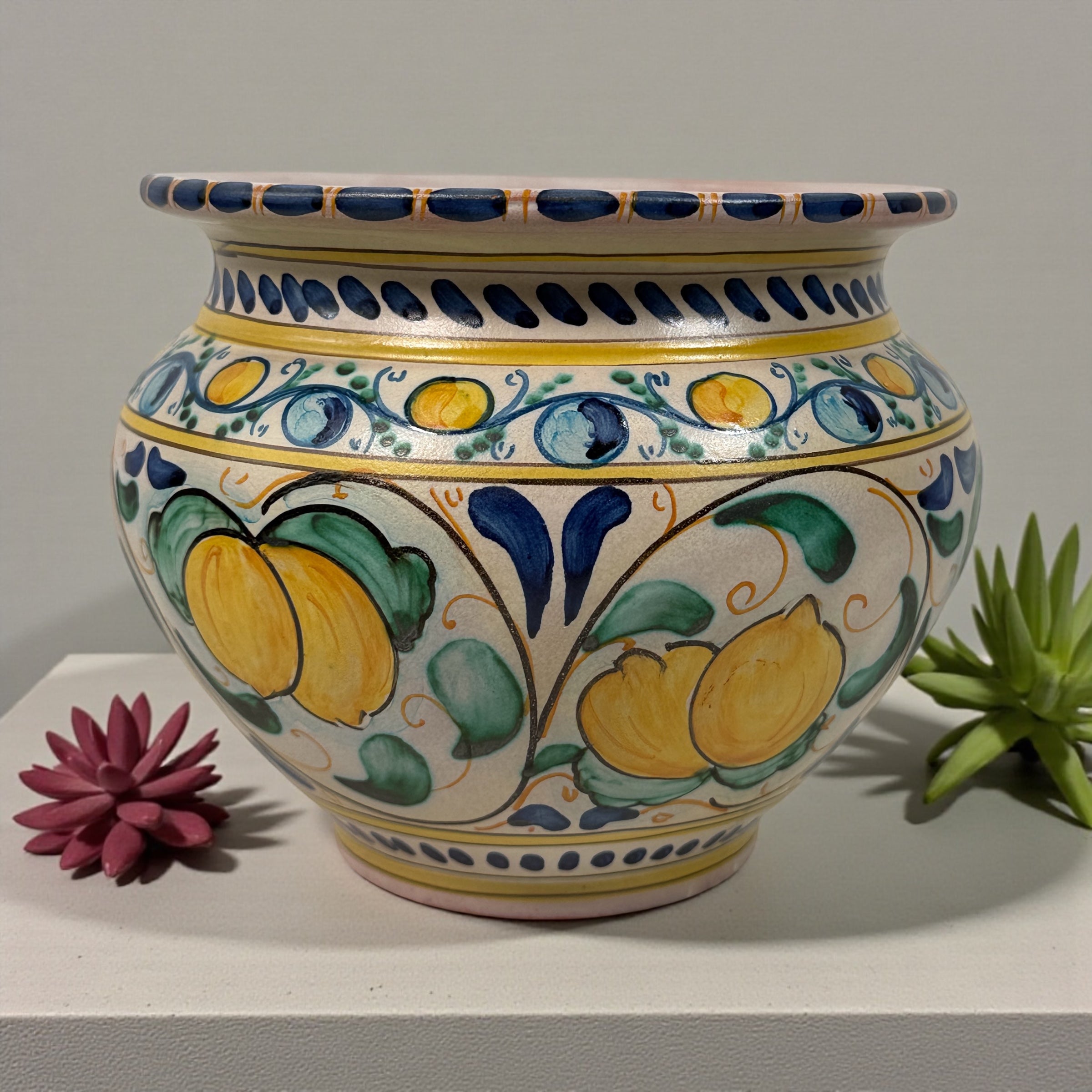 Hand-painted Spanish ceramic planter in blue and yellow majolica style. Vintage decorative cachepot with folk-art charm, ideal for plants or display.