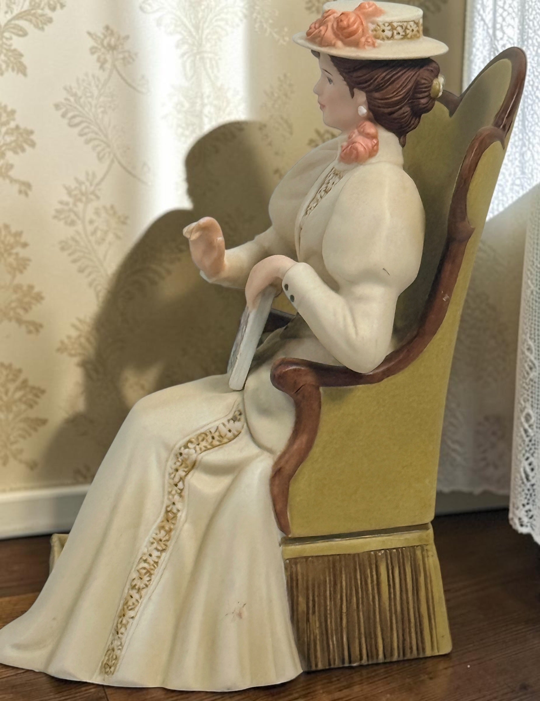 Official Avon Mrs. Albee Award figurine from 2011–2012 featuring Victorian styling, miniature cosmetics accessories, and bilingual commemorative inscription.