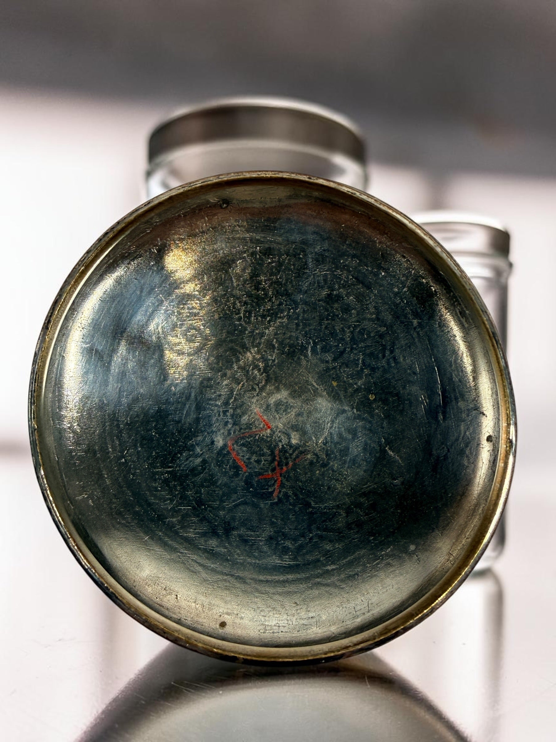 Antique Victorian glass tobacco humidor with ornate German silver overlay, engraved floral motifs, and domed lid. Elegant late-19th-century decorative storage jar.