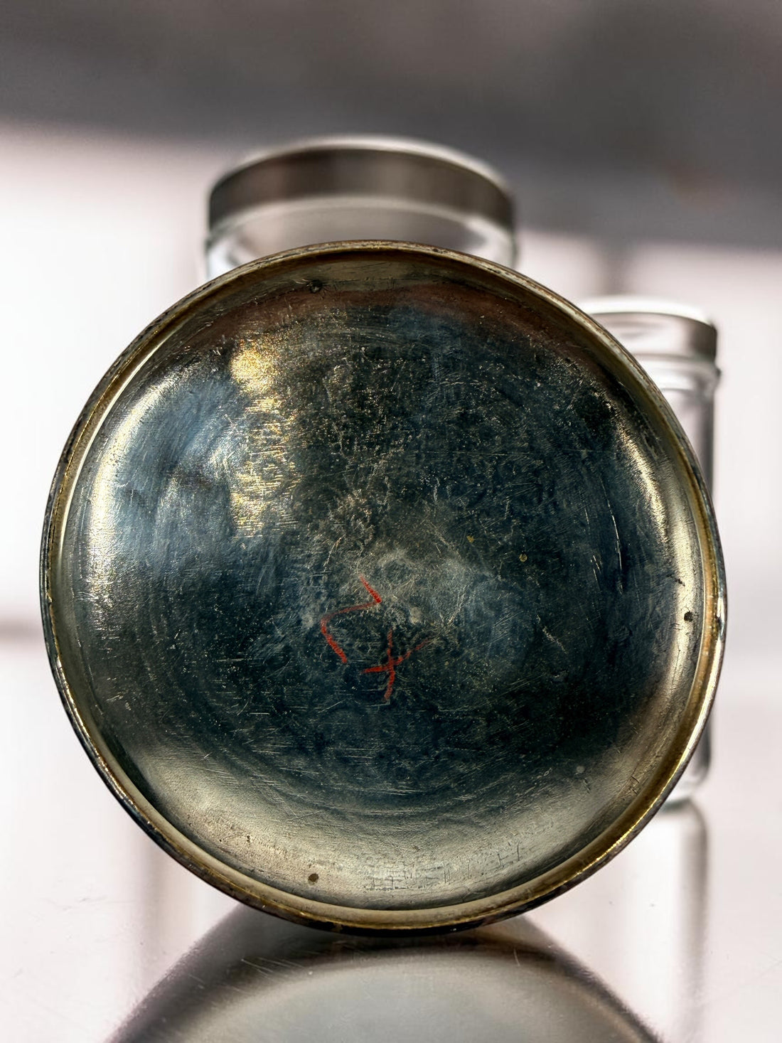 Antique Victorian glass tobacco humidor with ornate German silver overlay, engraved floral motifs, and domed lid. Elegant late-19th-century decorative storage jar.
