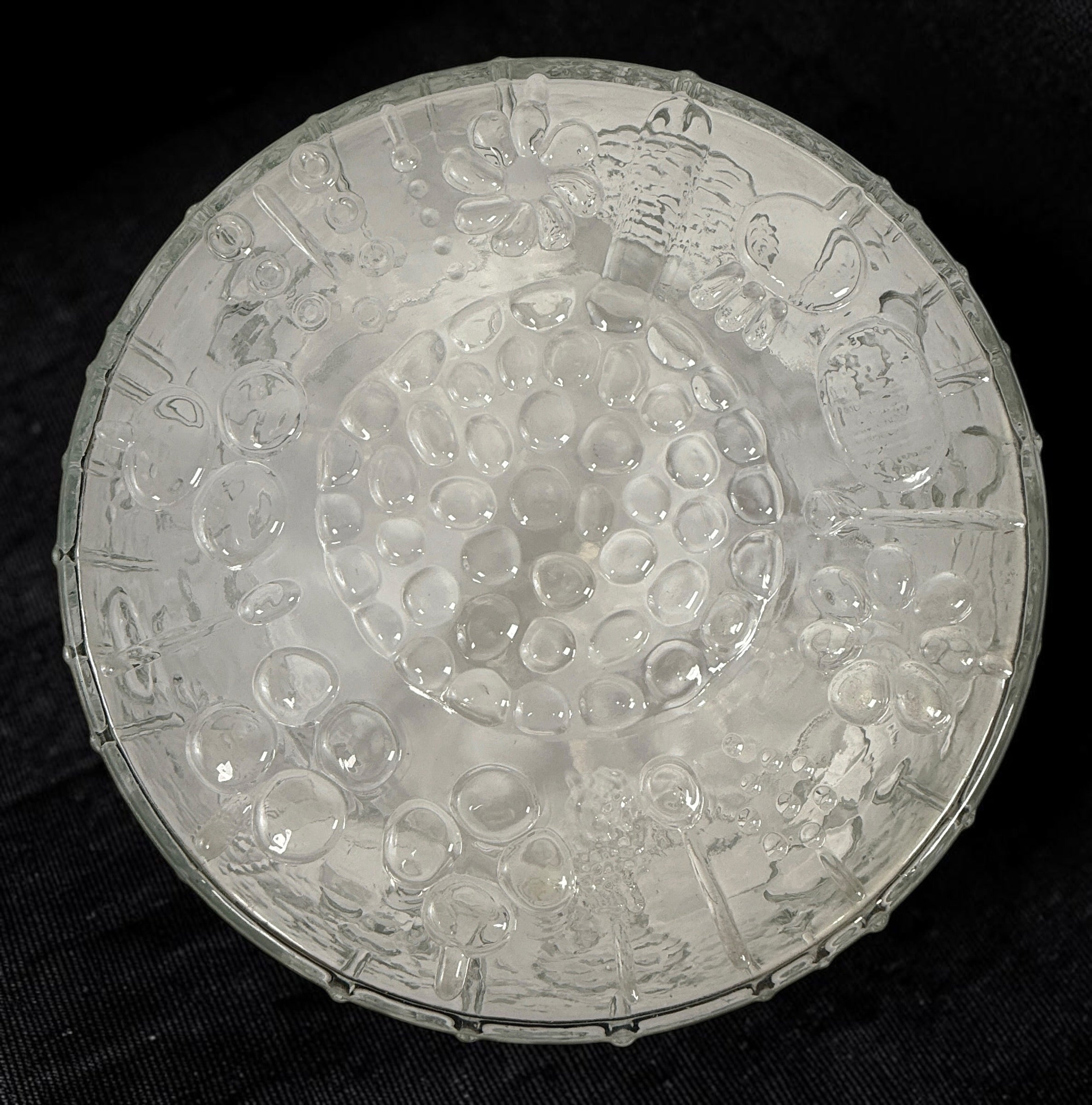 Vintage Iittala Flora centerpiece bowl designed by Oiva Toikka for Nuutajärvi, Finland. Large 9.5-inch clear pressed glass bowl with iconic botanical motifs from the 1960s.