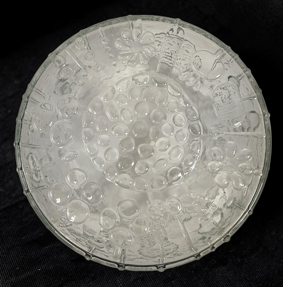 Vintage Iittala Flora centerpiece bowl designed by Oiva Toikka for Nuutajärvi, Finland. Large 9.5-inch clear pressed glass bowl with iconic botanical motifs from the 1960s.