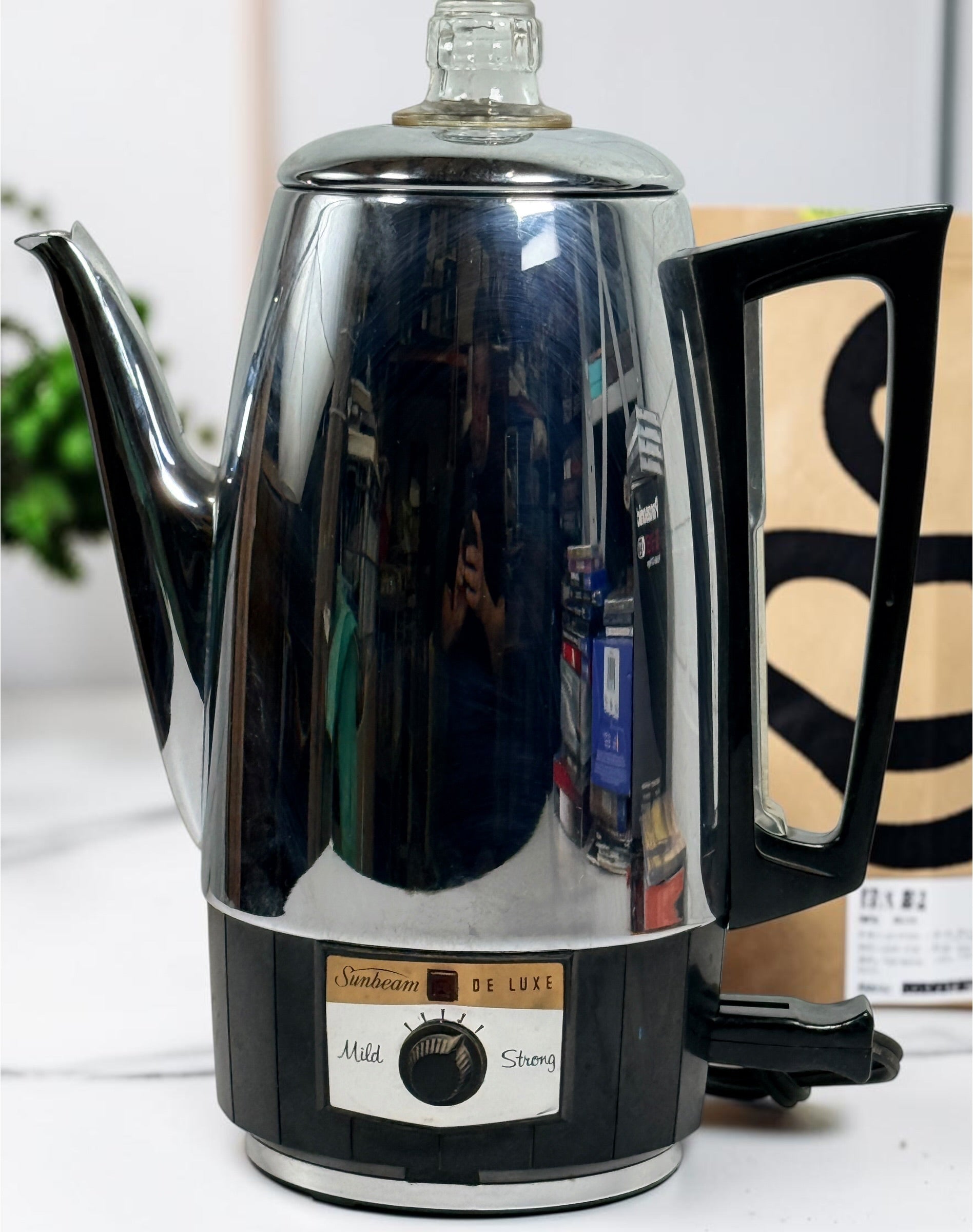 Vintage Sunbeam Coffeemaster Deluxe AP18 9-cup electric percolator made in Canada, featuring adjustable brew strength, a coffee-level gauge, and classic mid-century chrome styling.