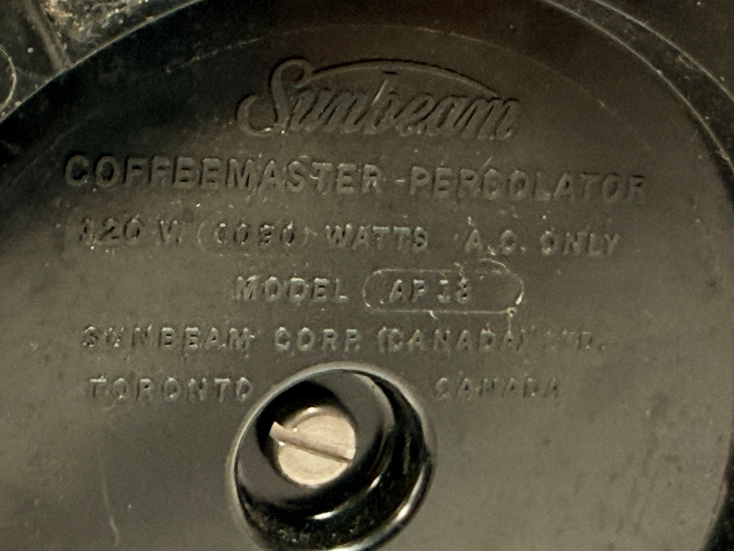 Vintage Sunbeam Coffeemaster Deluxe AP18 9-cup electric percolator made in Canada, featuring adjustable brew strength, a coffee-level gauge, and classic mid-century chrome styling.