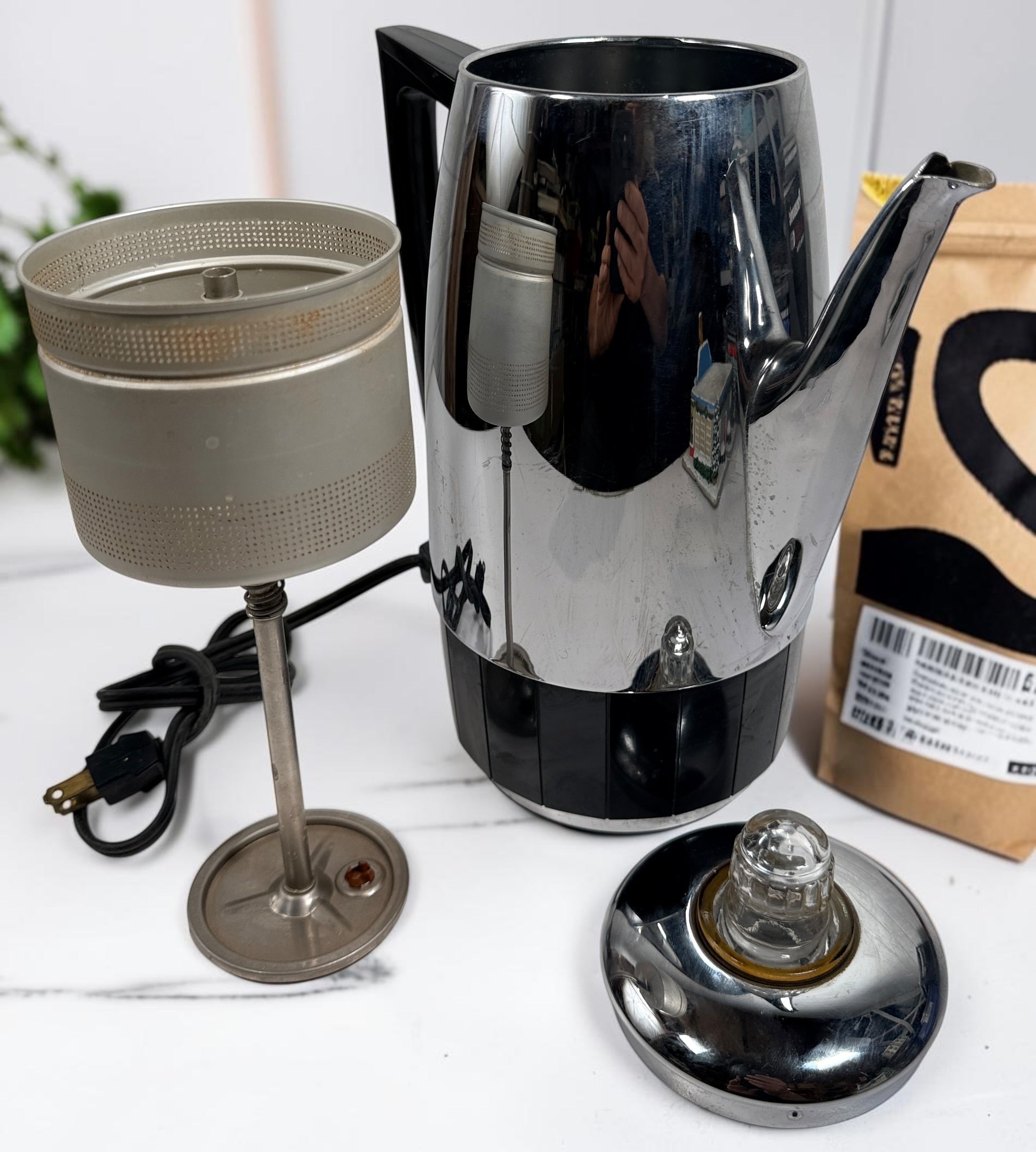 Vintage Sunbeam Coffeemaster Deluxe AP18 9-cup electric percolator made in Canada, featuring adjustable brew strength, a coffee-level gauge, and classic mid-century chrome styling.