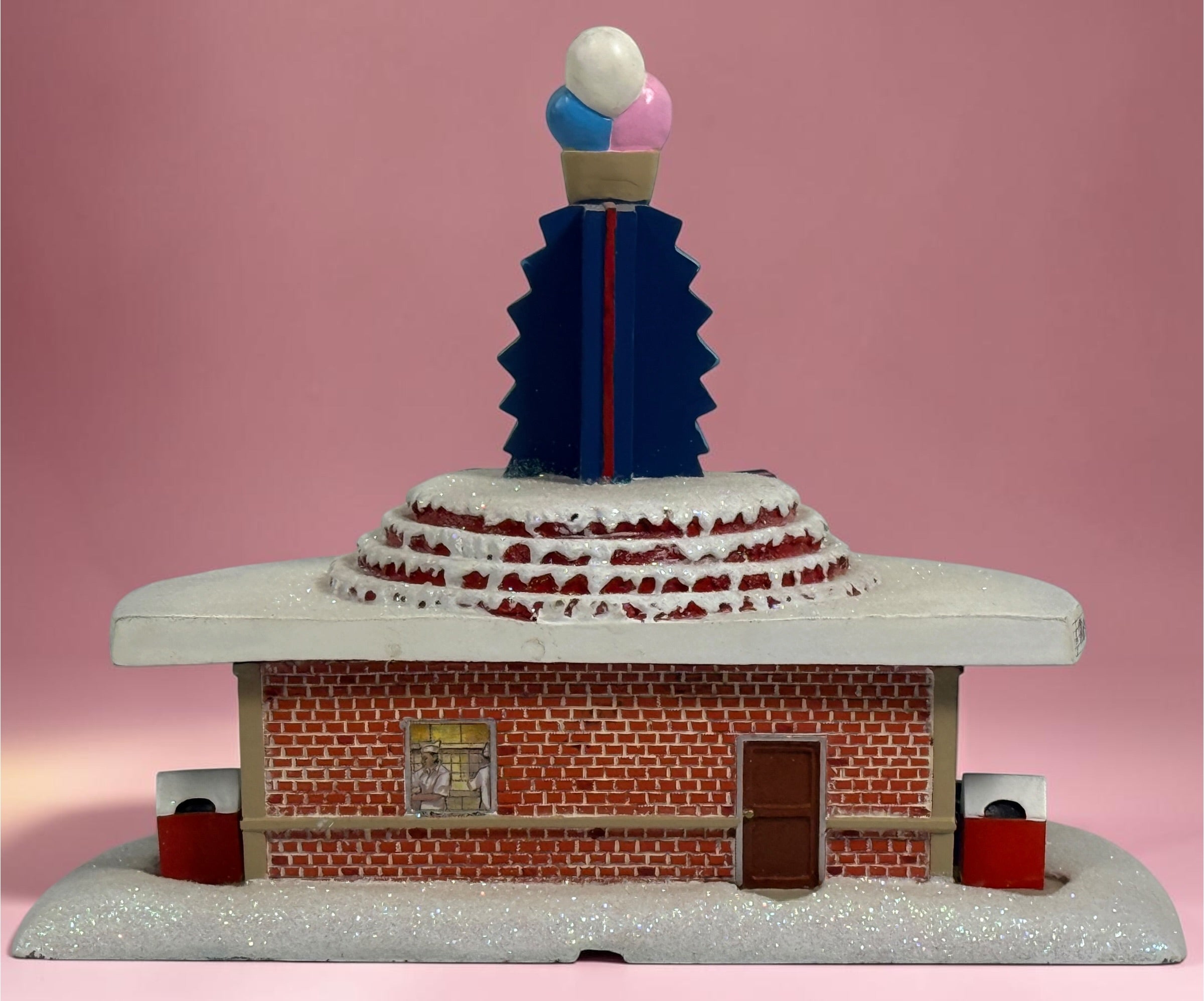 Official 2005 Hawthorne Village “All Shook Up” Soda Fountain from the Elvis Presley Rock ‘n’ Roll Holiday Village collection, featuring colorful retro diner details and snowy accents.