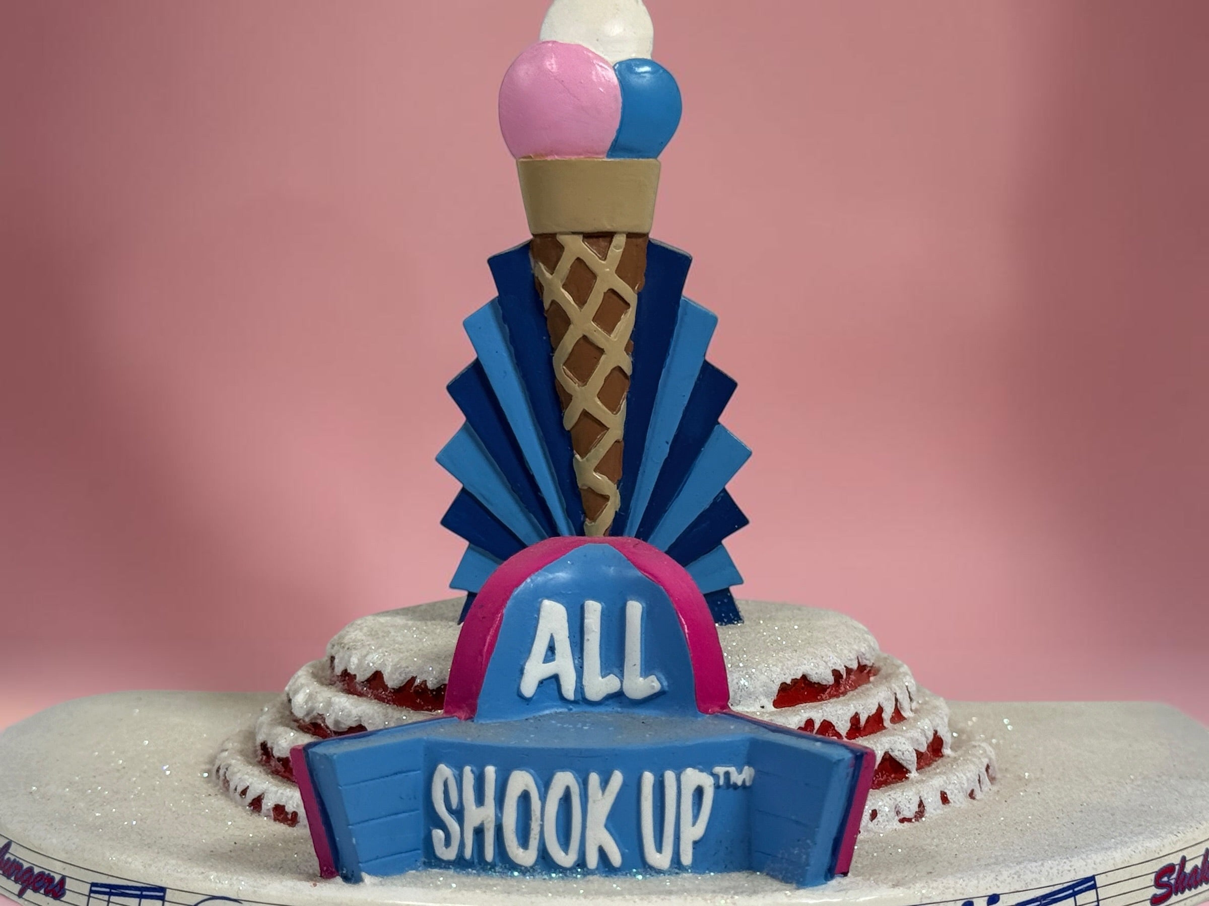 Official 2005 Hawthorne Village “All Shook Up” Soda Fountain from the Elvis Presley Rock ‘n’ Roll Holiday Village collection, featuring colorful retro diner details and snowy accents.