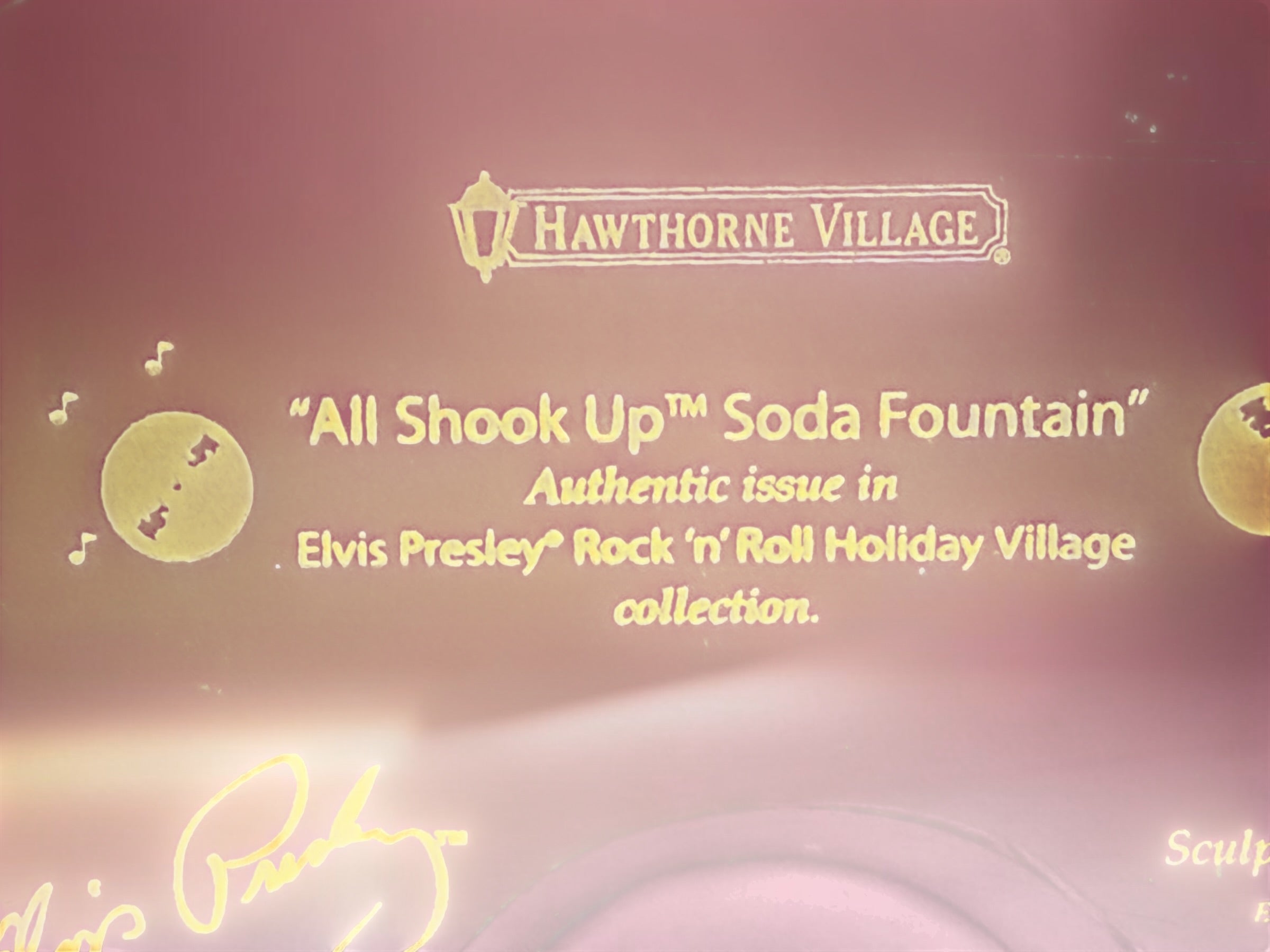 Official 2005 Hawthorne Village “All Shook Up” Soda Fountain from the Elvis Presley Rock ‘n’ Roll Holiday Village collection, featuring colorful retro diner details and snowy accents.