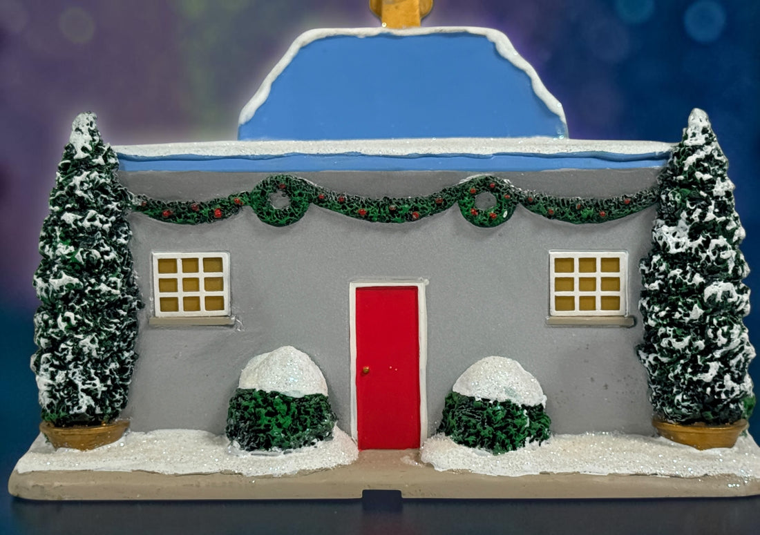 Official Hawthorne Village “Playing for Keeps” Guitar Store from the 2007 Elvis Presley Rock ‘n’ Roll Holiday Village collection featuring festive details and retro styling.