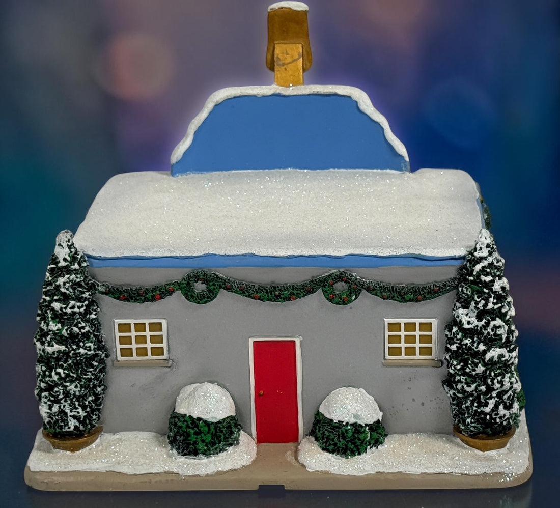 Official Hawthorne Village “Playing for Keeps” Guitar Store from the 2007 Elvis Presley Rock ‘n’ Roll Holiday Village collection featuring festive details and retro styling.