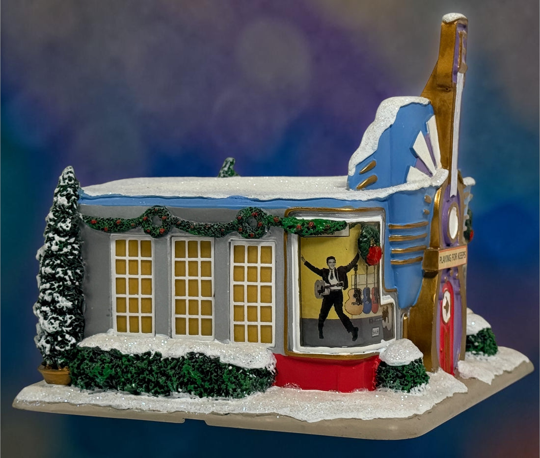 Official Hawthorne Village “Playing for Keeps” Guitar Store from the 2007 Elvis Presley Rock ‘n’ Roll Holiday Village collection featuring festive details and retro styling.