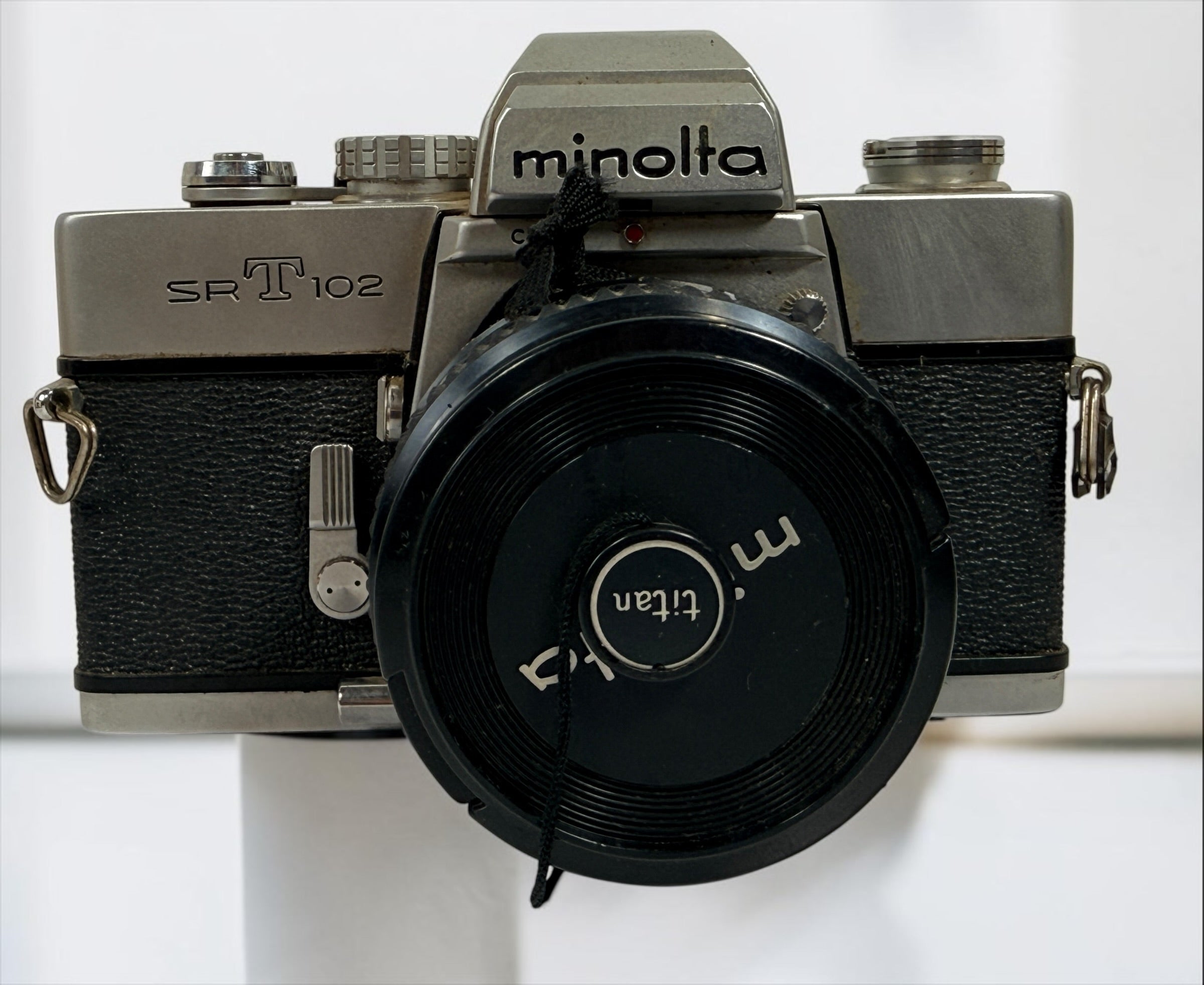 Vintage Minolta SRT 102 35 mm film camera with MC Rokkor-X 50 mm f/1.7 lens, made in Japan. Classic manual-focus SLR sold in untested condition.