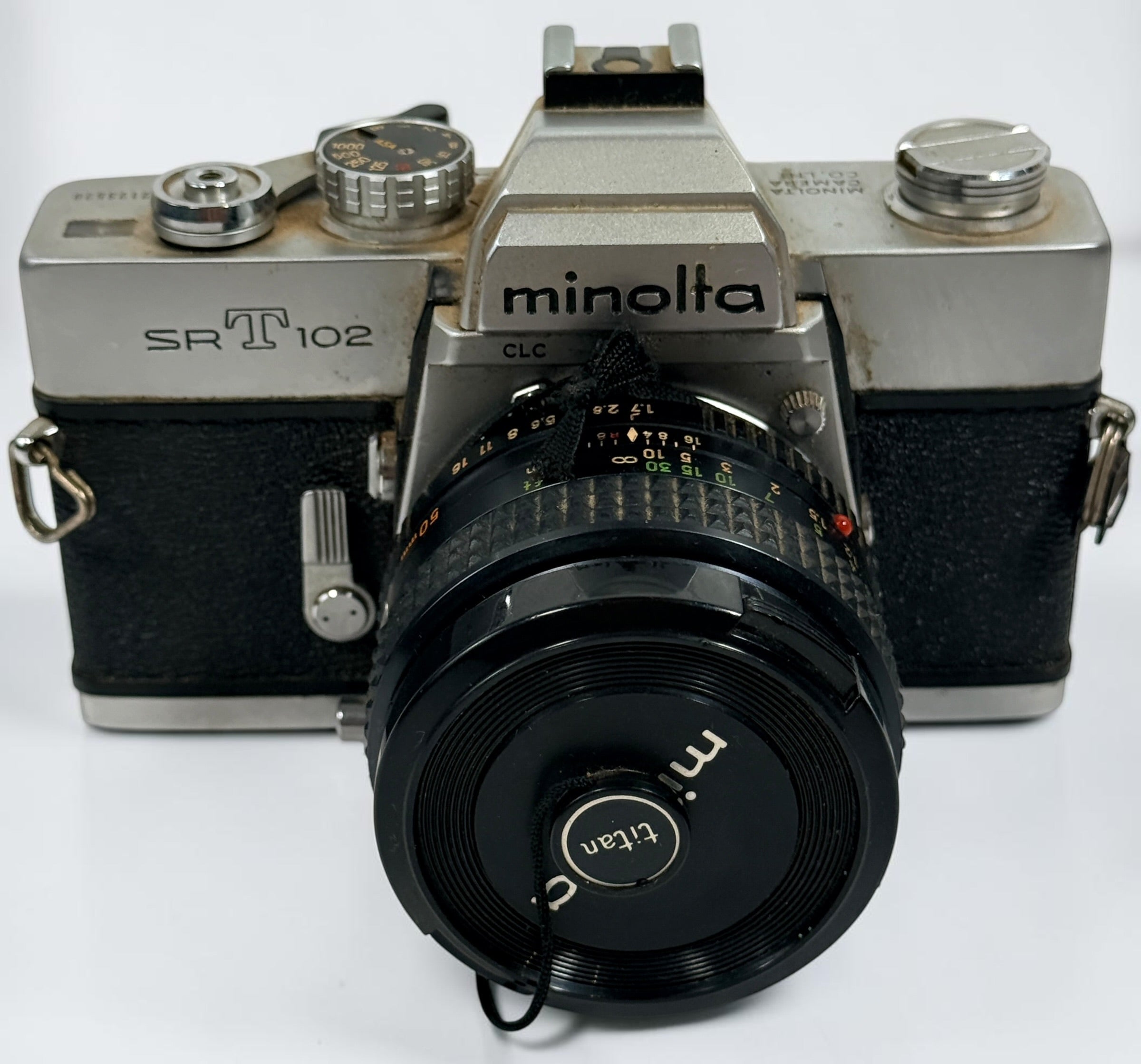 Vintage Minolta SRT 102 35 mm film camera with MC Rokkor-X 50 mm f/1.7 lens, made in Japan. Classic manual-focus SLR sold in untested condition.