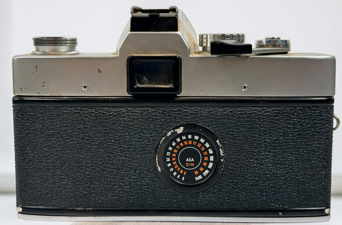 Vintage Minolta SRT 102 35 mm film camera with MC Rokkor-X 50 mm f/1.7 lens, made in Japan. Classic manual-focus SLR sold in untested condition.