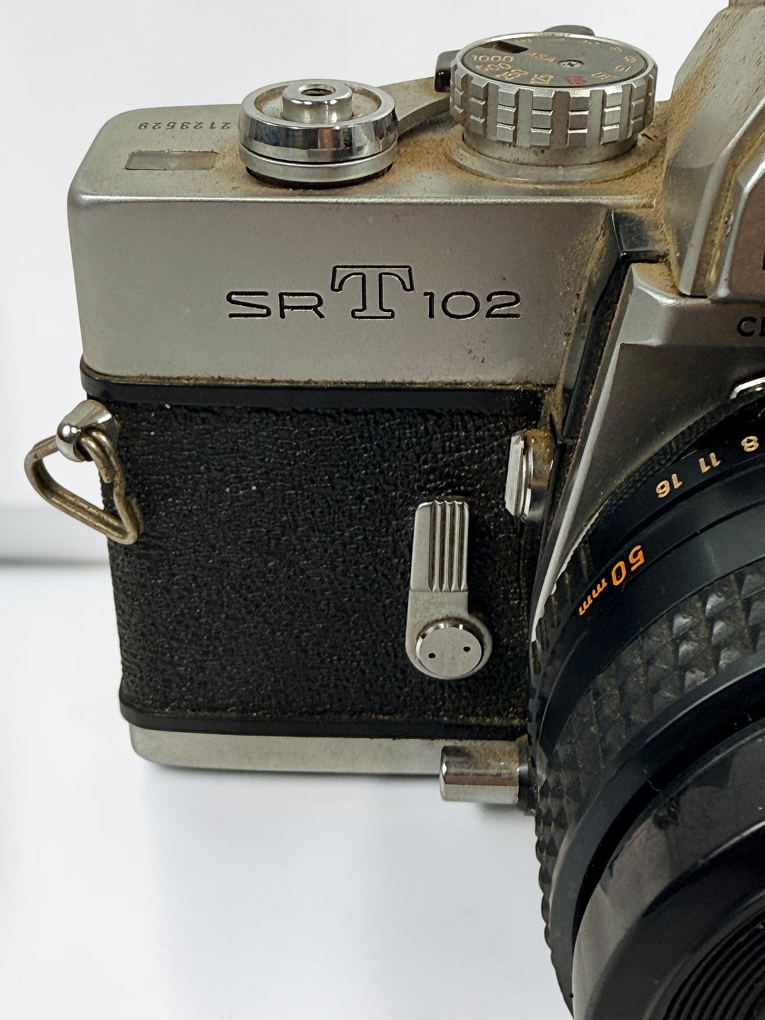 Vintage Minolta SRT 102 35 mm film camera with MC Rokkor-X 50 mm f/1.7 lens, made in Japan. Classic manual-focus SLR sold in untested condition.