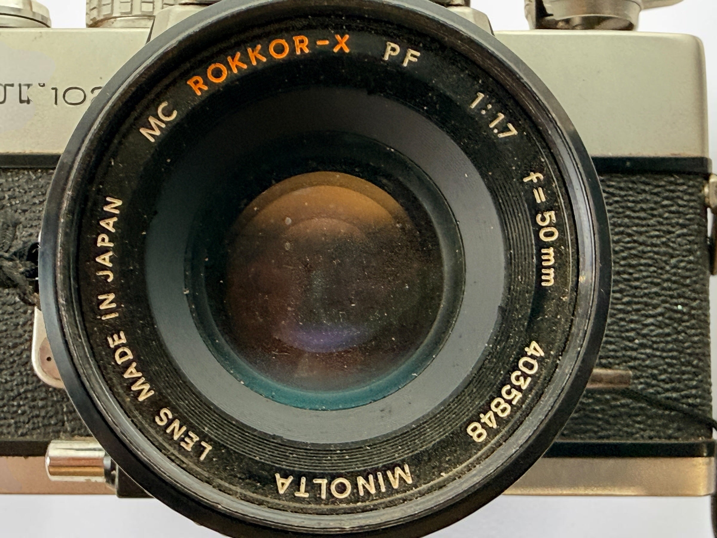 Vintage Minolta SRT 102 35 mm film camera with MC Rokkor-X 50 mm f/1.7 lens, made in Japan. Classic manual-focus SLR sold in untested condition.
