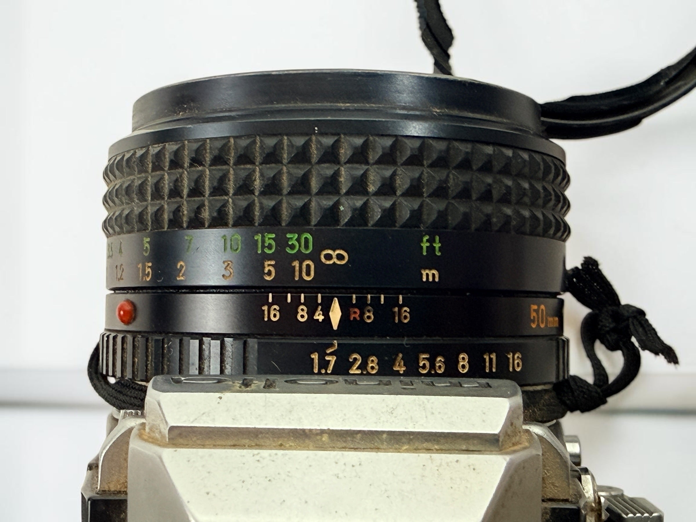 Vintage Minolta SRT 102 35 mm film camera with MC Rokkor-X 50 mm f/1.7 lens, made in Japan. Classic manual-focus SLR sold in untested condition.