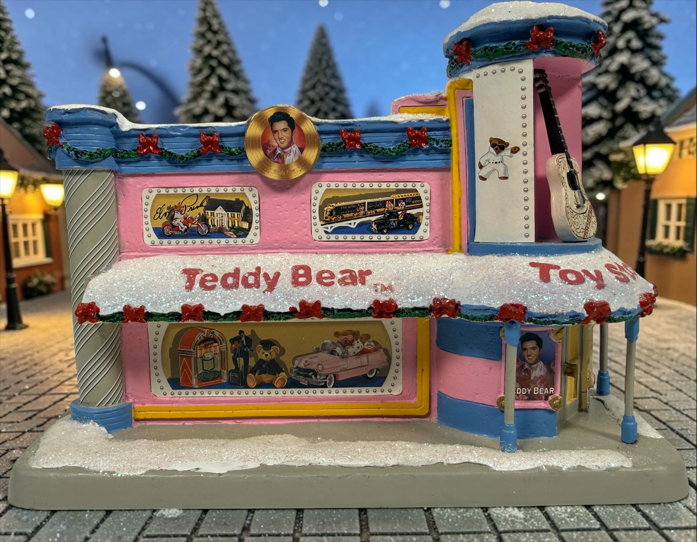 Hawthorne Village Elvis Presley Teddy Bear Toy Store from the 2006 Rock ’n’ Roll Holiday Village. Sculpture A0628. Untested, light cord missing.