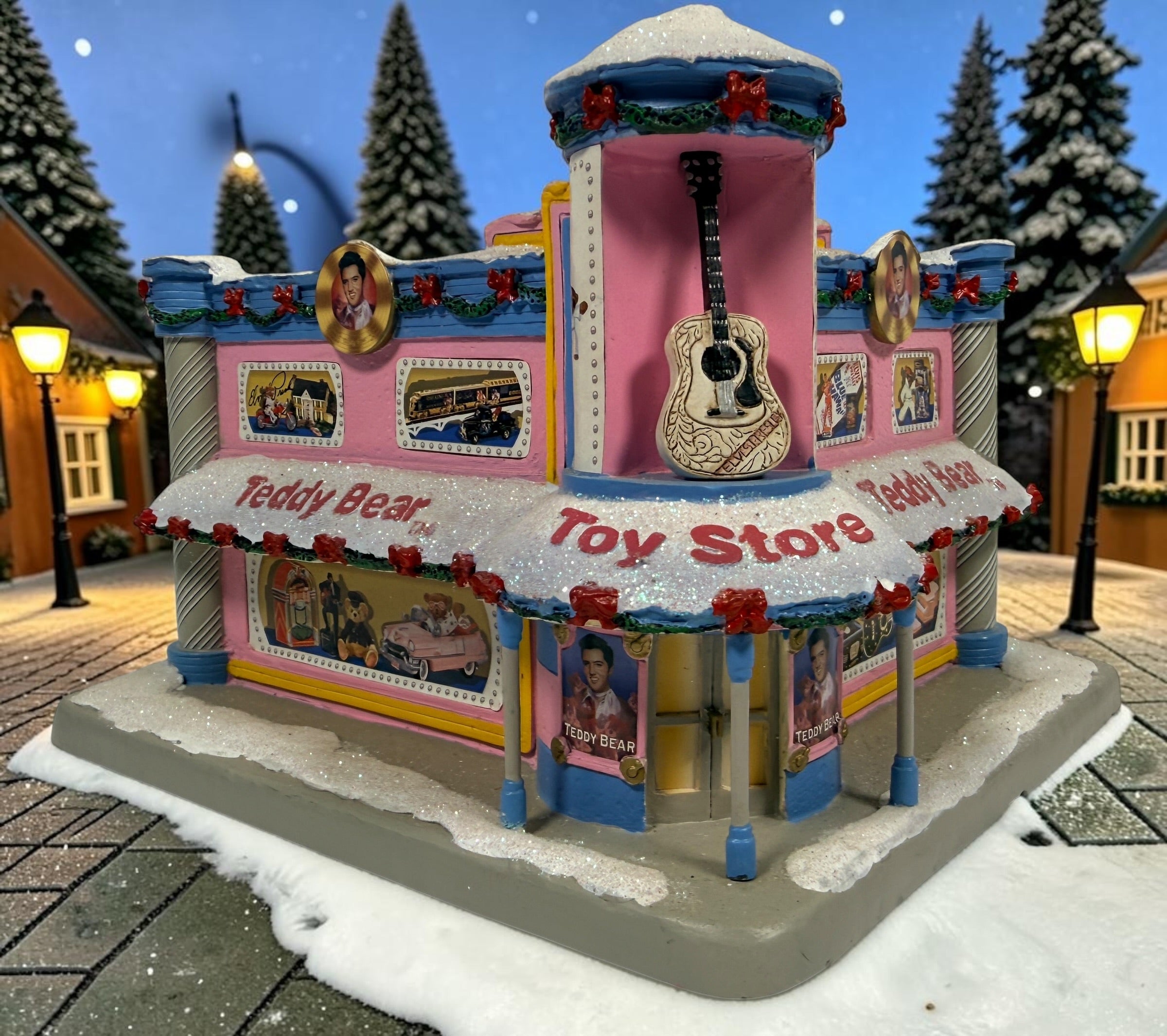 Hawthorne Village Elvis Presley Teddy Bear Toy Store from the 2006 Rock ’n’ Roll Holiday Village. Sculpture A0628. Untested, light cord missing.