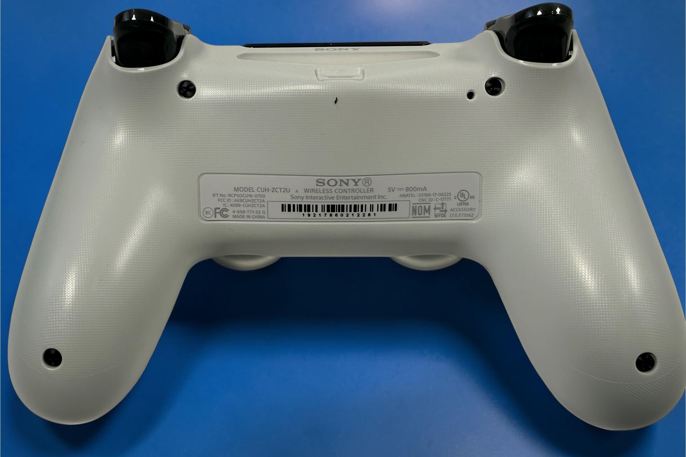 Sony DualShock 4 V2 Crystal PS4 wireless controller CUH-ZCT2U with original box. Genuine transparent Sony PlayStation controller.