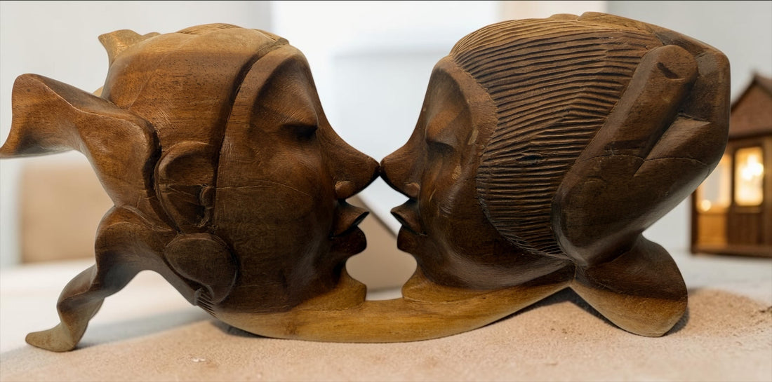 Vintage 8.5-inch Balinese kissing couple sculpture, hand carved in Indonesia from solid wood. Romantic Indonesian folk art with warm natural finish.