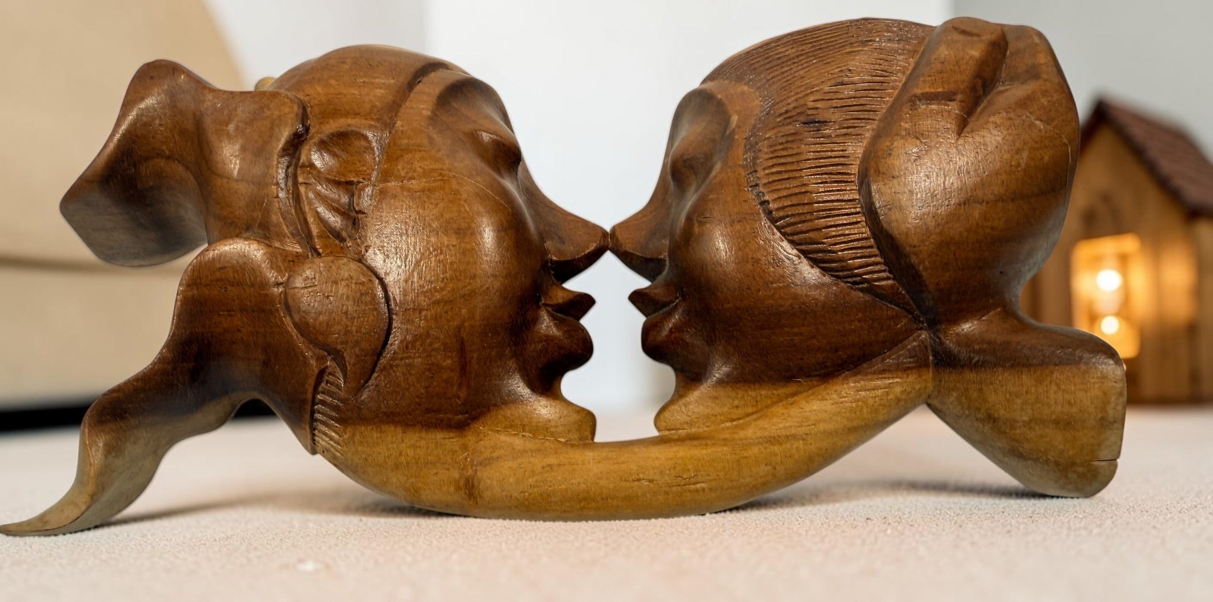 Vintage 8.5-inch Balinese kissing couple sculpture, hand carved in Indonesia from solid wood. Romantic Indonesian folk art with warm natural finish.