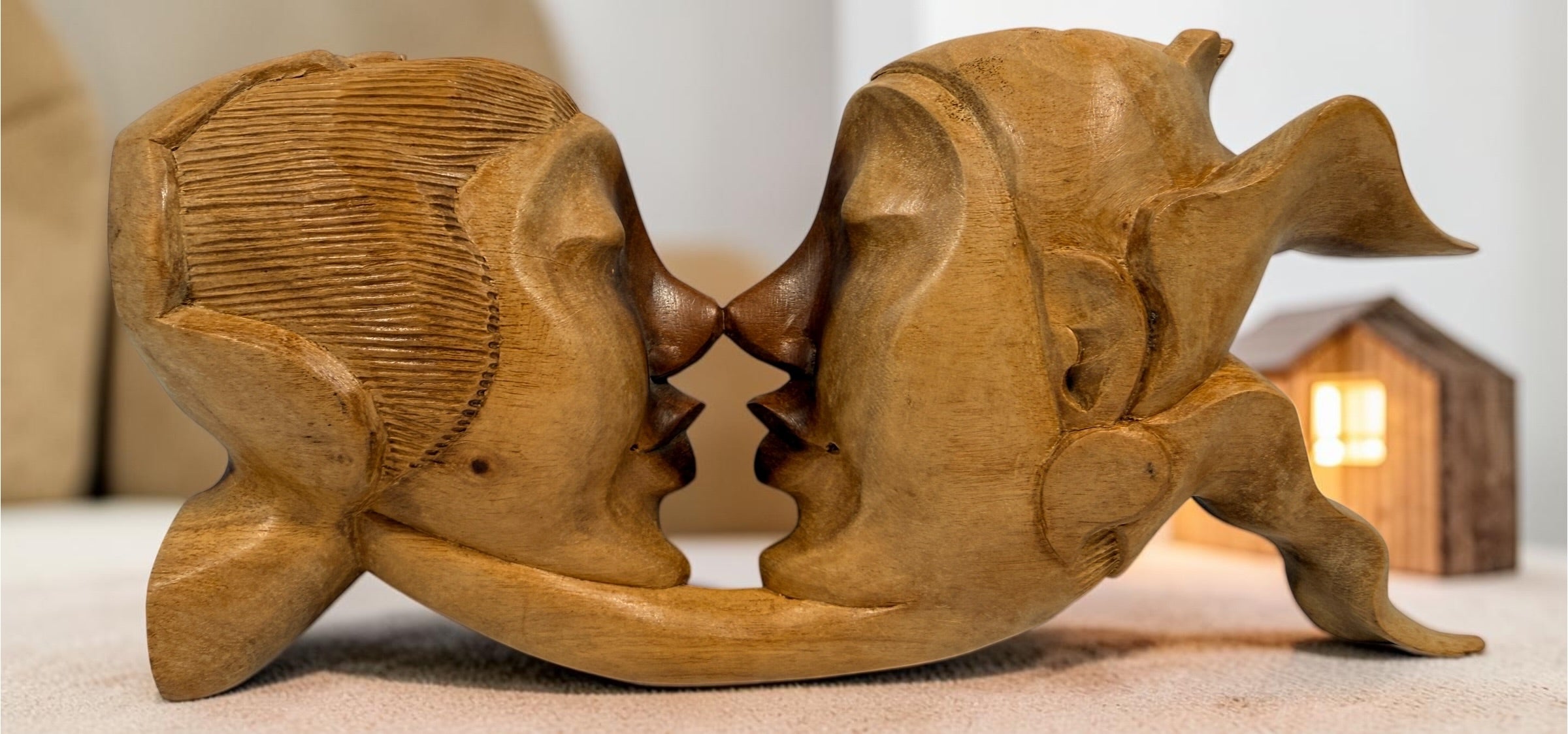 Vintage 8.5-inch Balinese kissing couple sculpture, hand carved in Indonesia from solid wood. Romantic Indonesian folk art with warm natural finish.