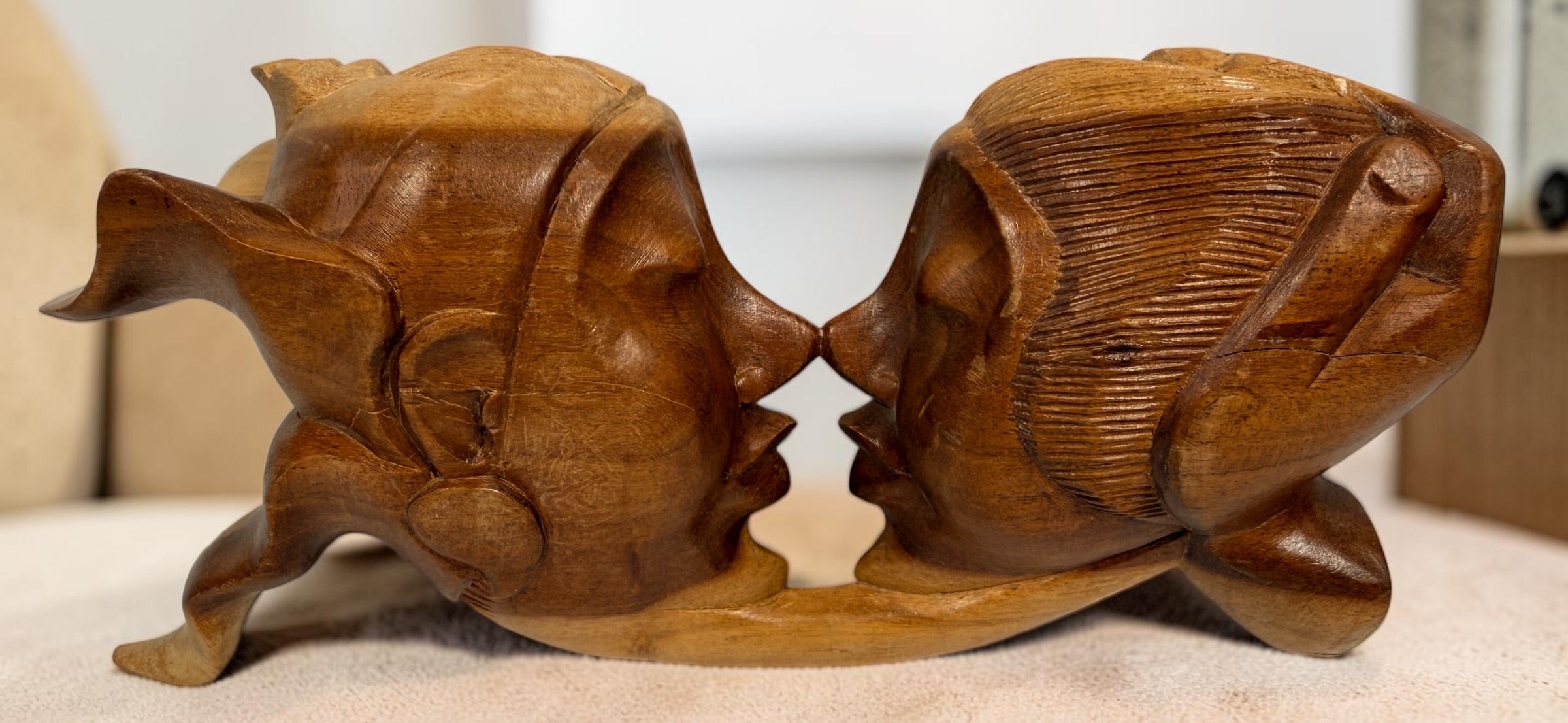 Vintage 8.5-inch Balinese kissing couple sculpture, hand carved in Indonesia from solid wood. Romantic Indonesian folk art with warm natural finish.
