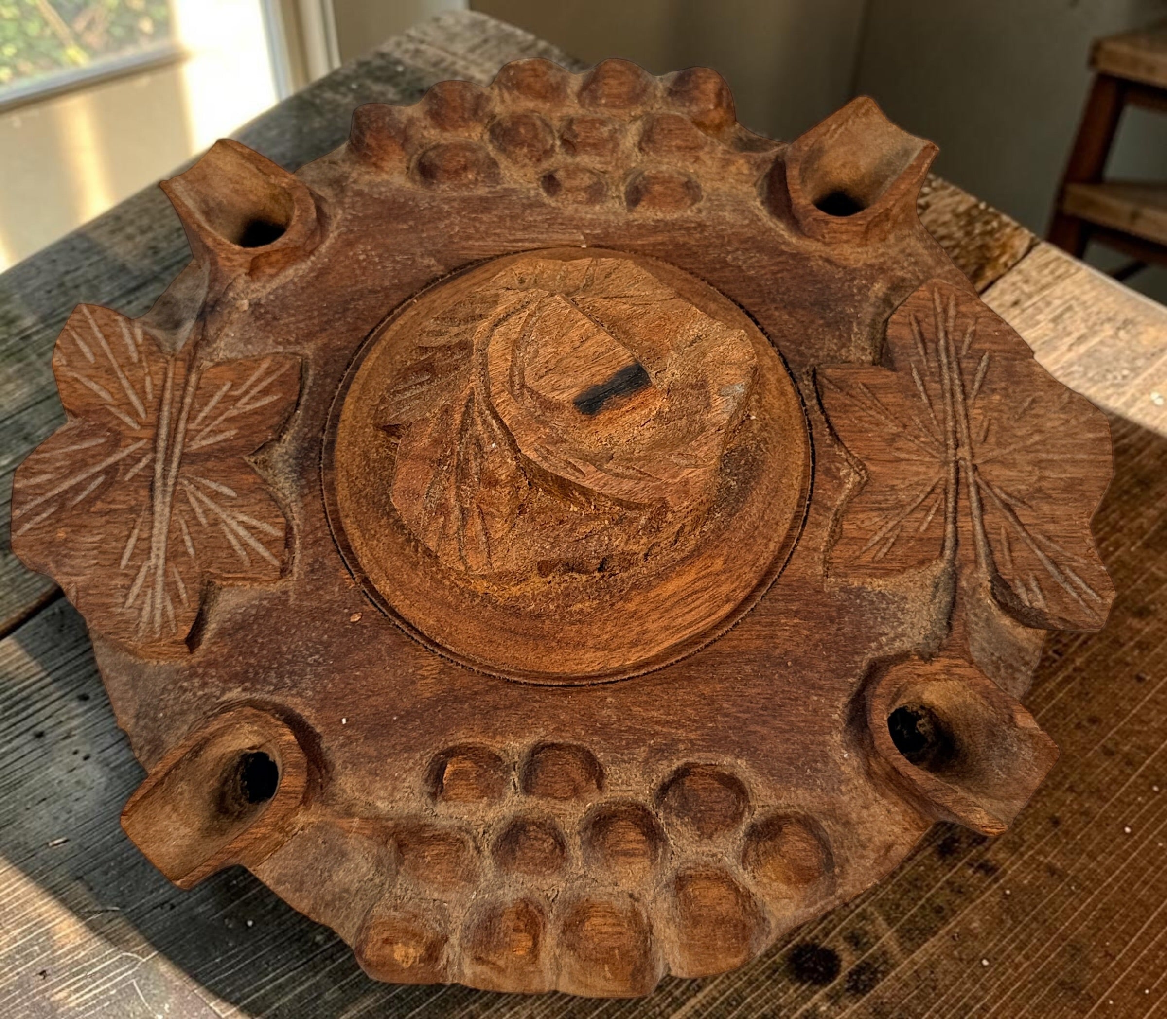 Vintage Savoyard wooden grolle with 4 drinking spouts, carved grapes and vine leaves. Traditional French Alpine communal coffee vessel and folk art.