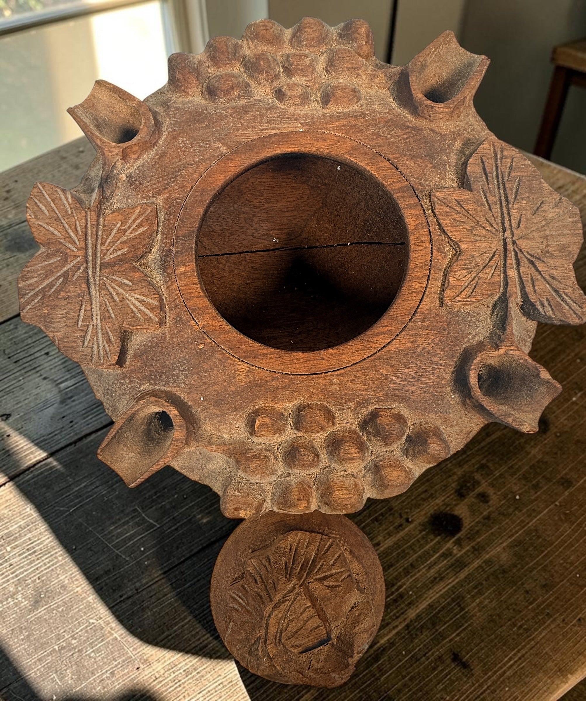 Vintage Savoyard wooden grolle with 4 drinking spouts, carved grapes and vine leaves. Traditional French Alpine communal coffee vessel and folk art.