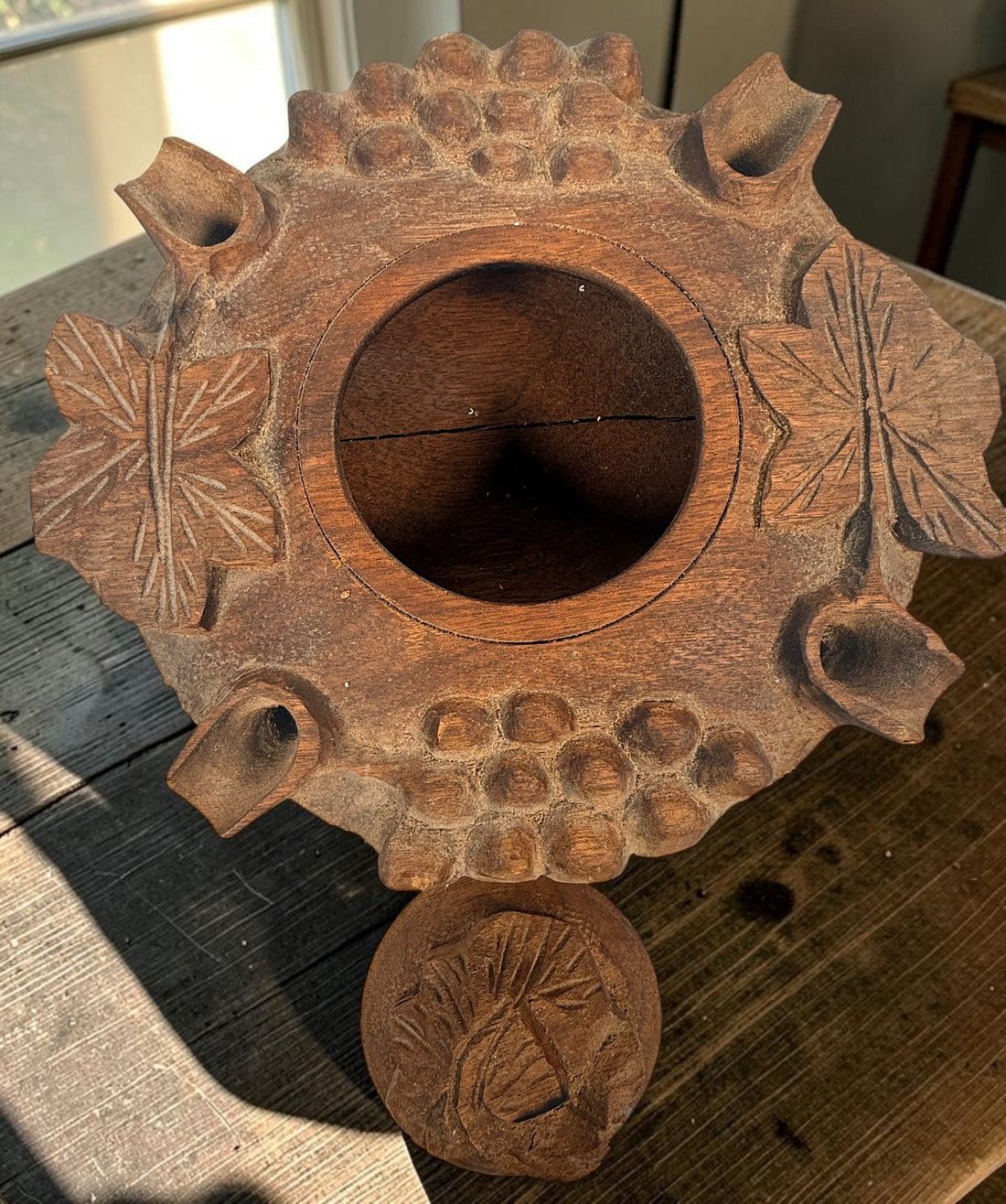 Vintage Savoyard wooden grolle with 4 drinking spouts, carved grapes and vine leaves. Traditional French Alpine communal coffee vessel and folk art.
