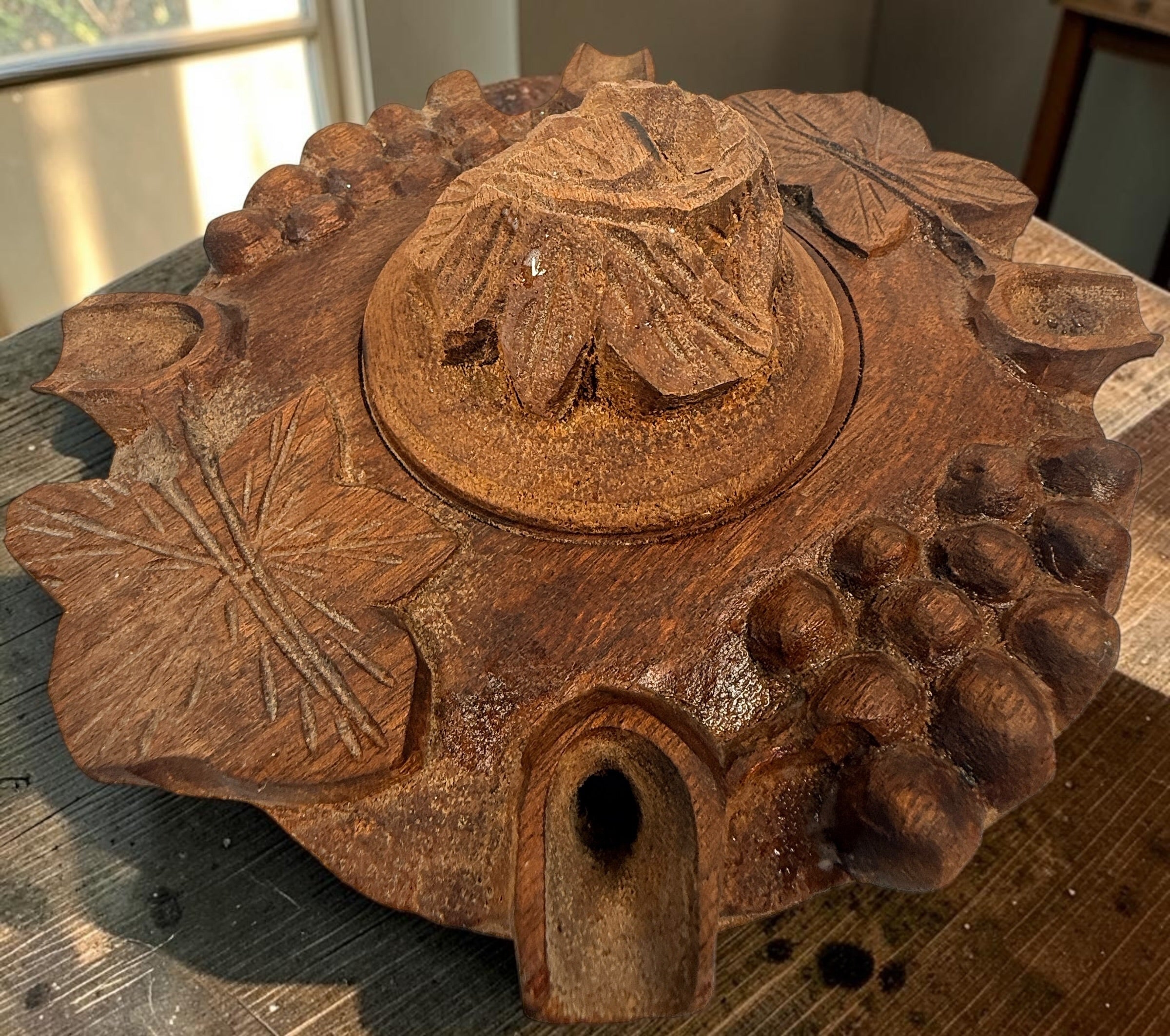 Vintage Savoyard wooden grolle with 4 drinking spouts, carved grapes and vine leaves. Traditional French Alpine communal coffee vessel and folk art.