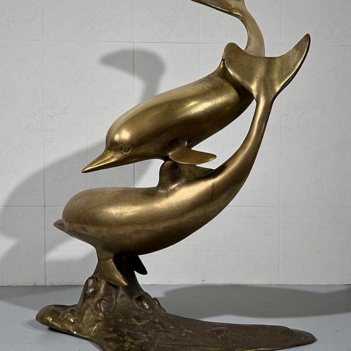 Vintage mid-century brass dolphin sculpture, 13.5 inches tall. Solid cast brass with natural patina, coastal Hollywood Regency decor.