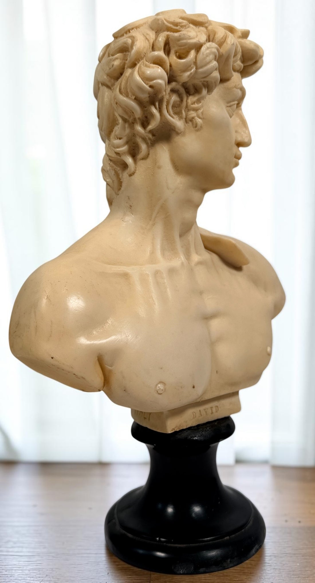 Vintage A. Santini Michelangelo David bust, made in Italy with faux-alabaster finish and black pedestal base. Classic Italian decorative sculpture.